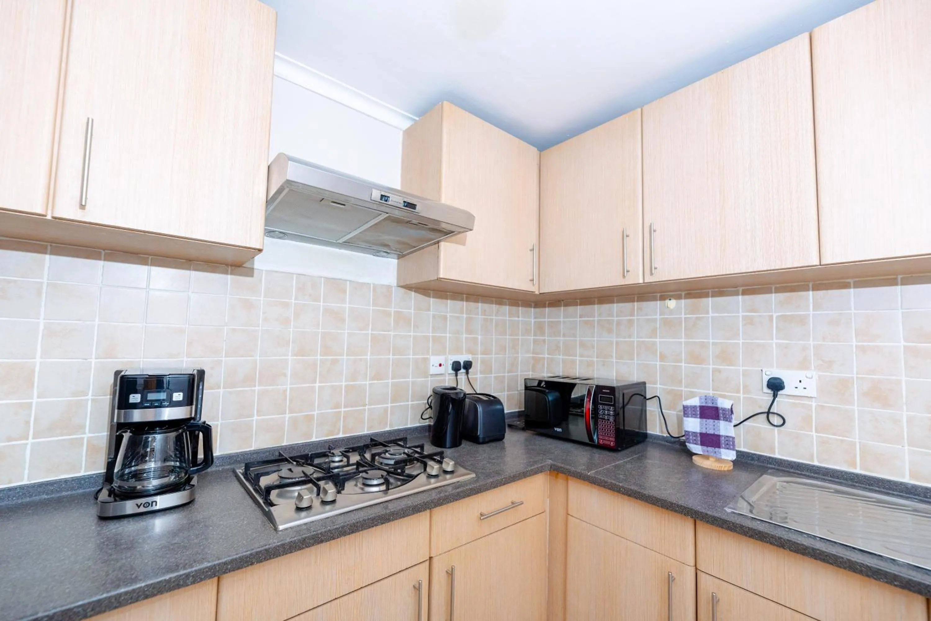 Kitchen or kitchenette in Heri Heights Hotel Apartments, SureStay Collection by Best Western