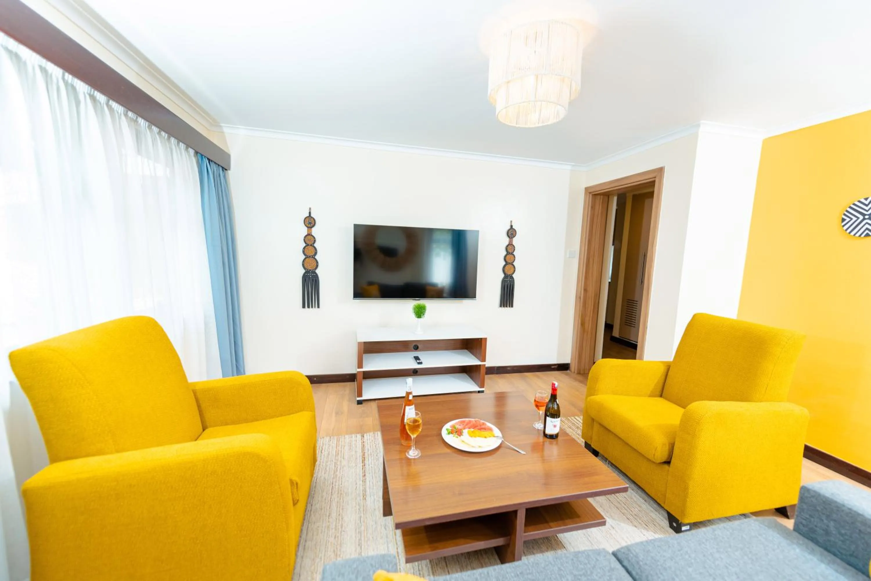 Communal lounge/ TV room in Heri Heights Hotel Apartments, SureStay Collection by Best Western