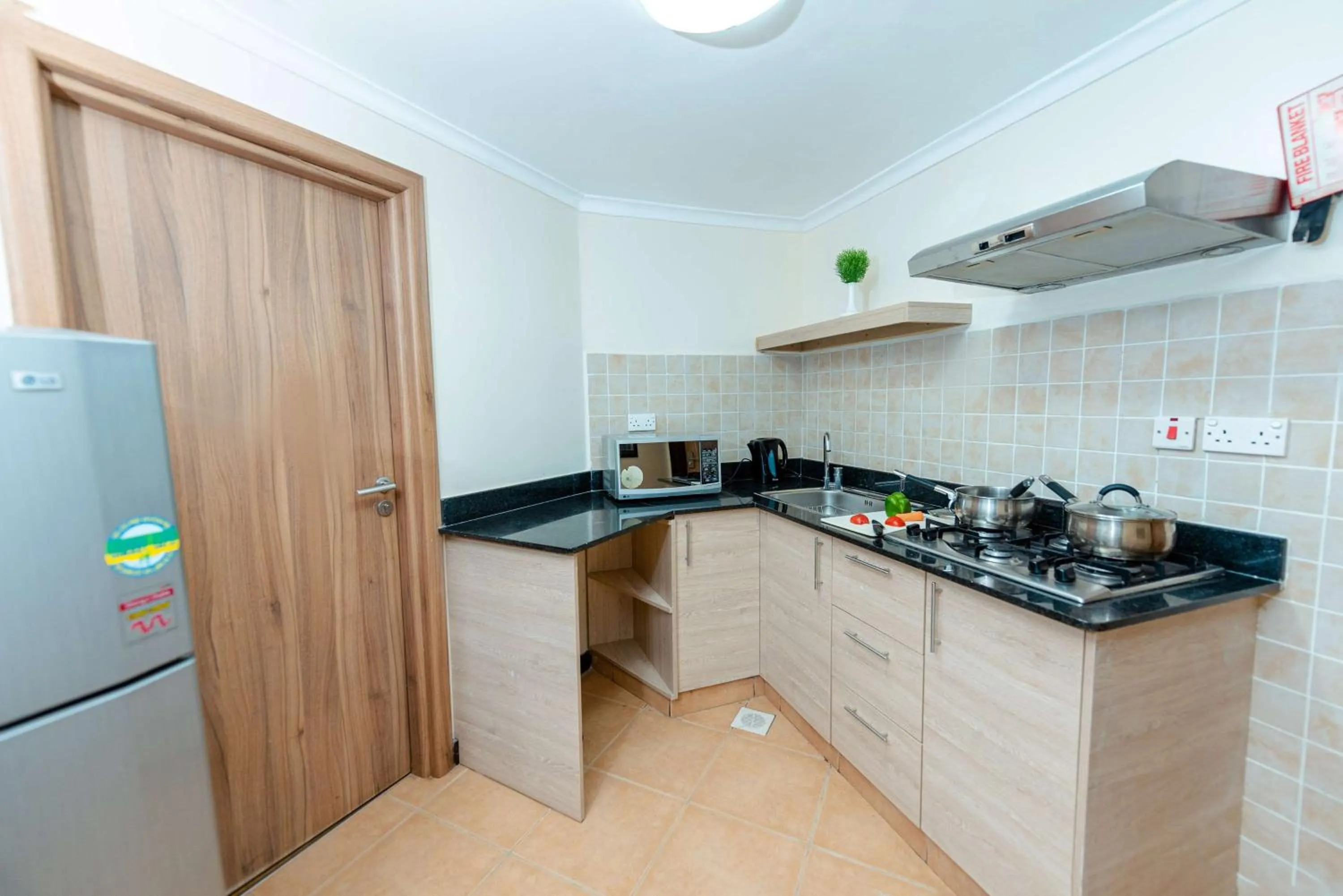 Kitchen or kitchenette in Heri Heights Hotel Apartments, SureStay Collection by Best Western