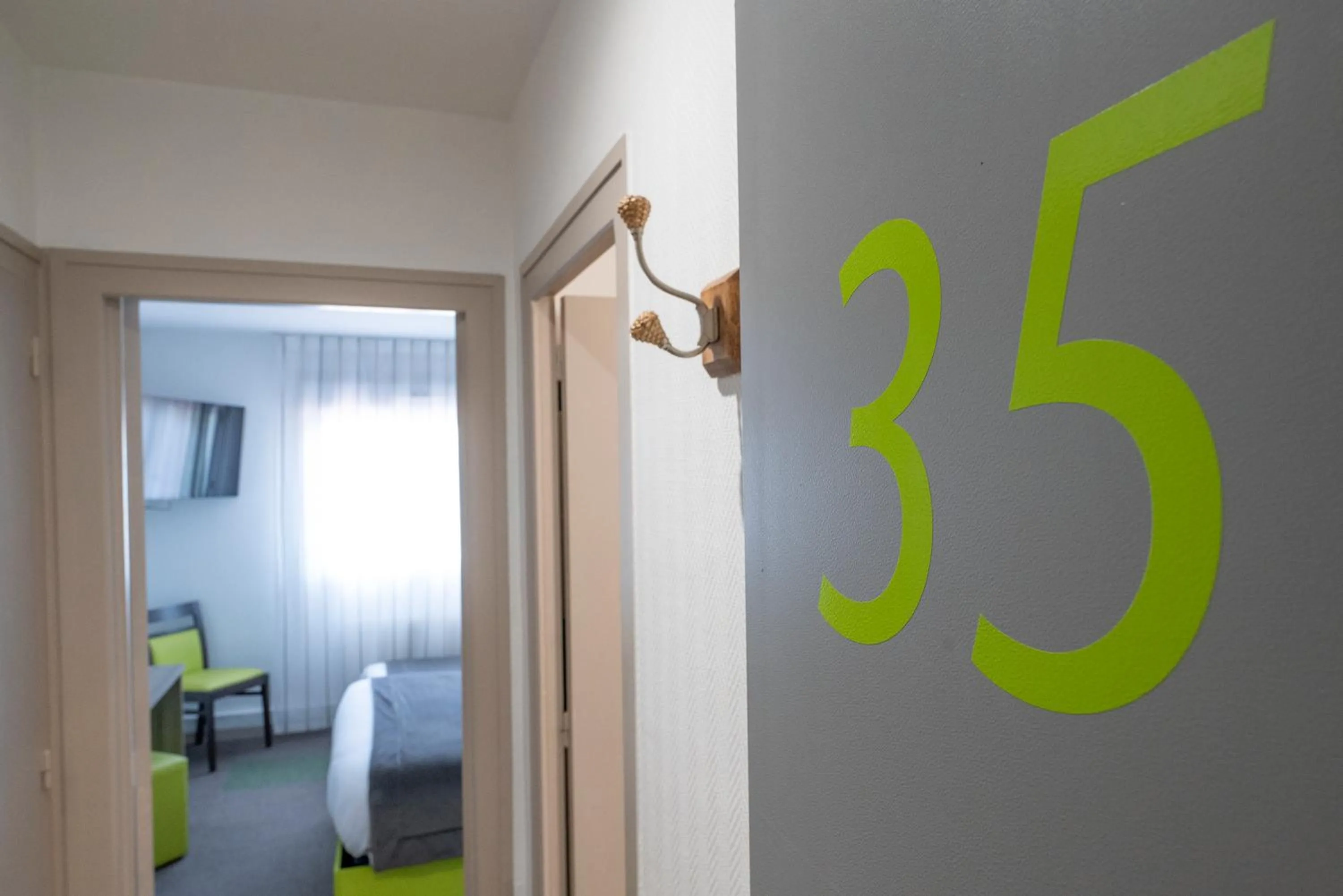 Photo of the whole room, Bed in Contact Hôtel O'Nice Saintes