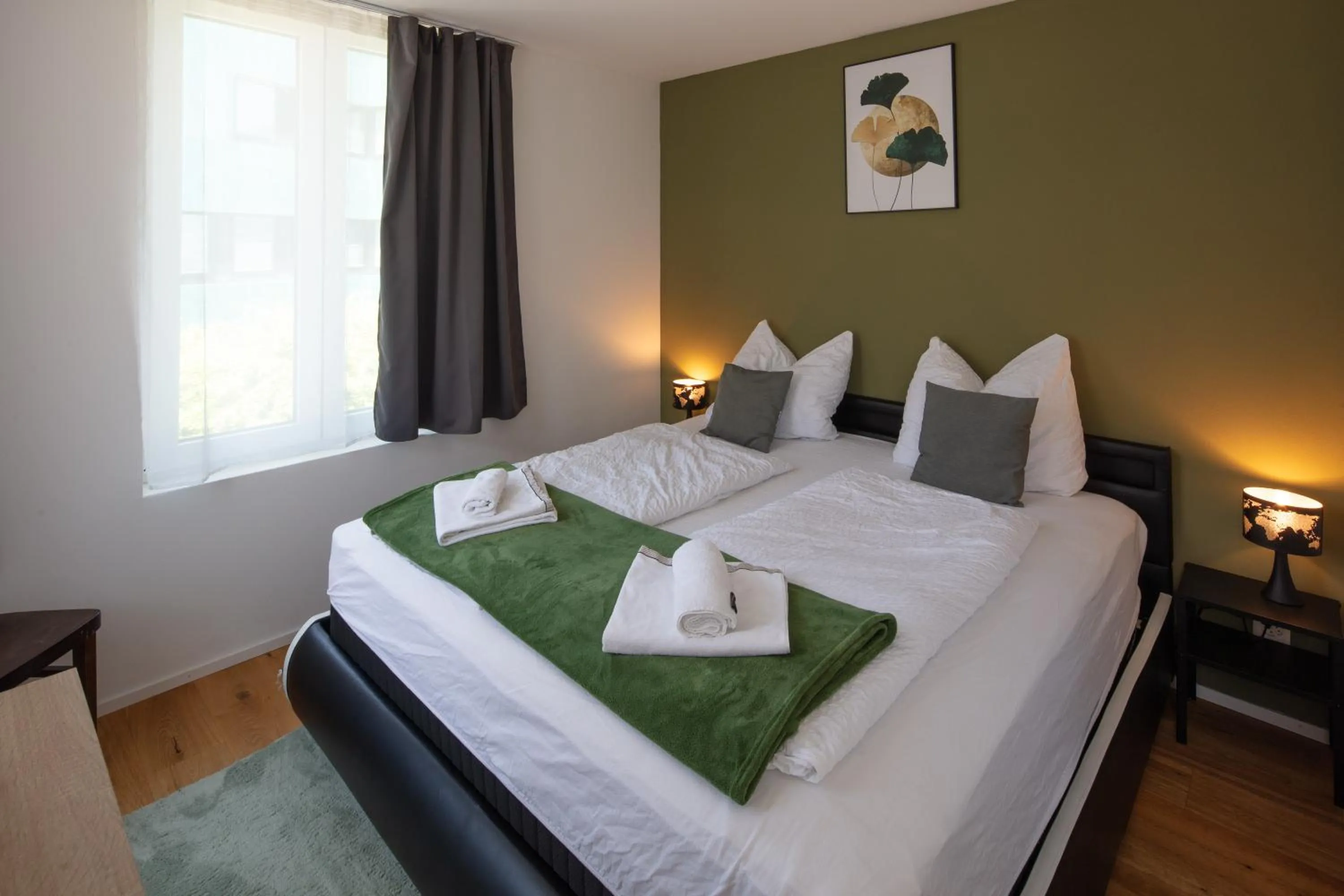 Bed in BERG & BERG APARTMENTS - Spiez Self-Check-in