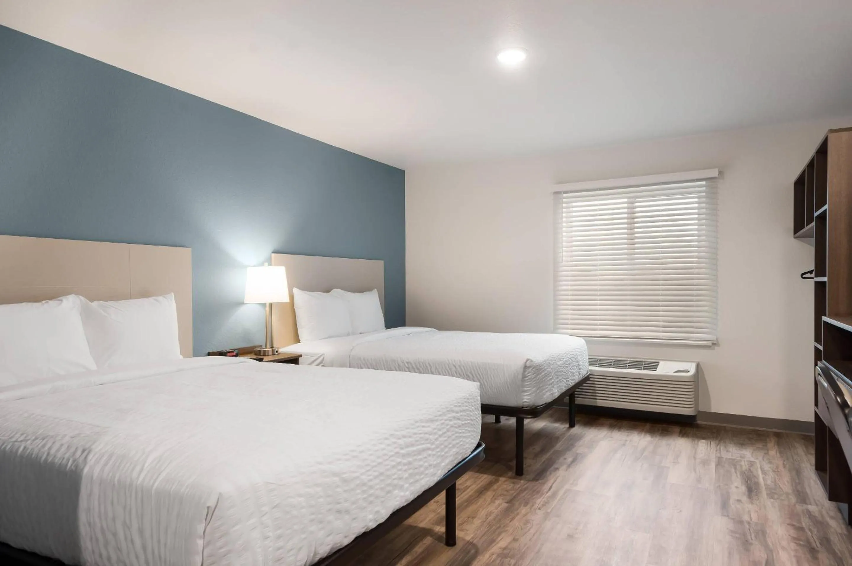 Bedroom, Bed in WoodSpring Suites Tampa Airport North Veterans Expressway