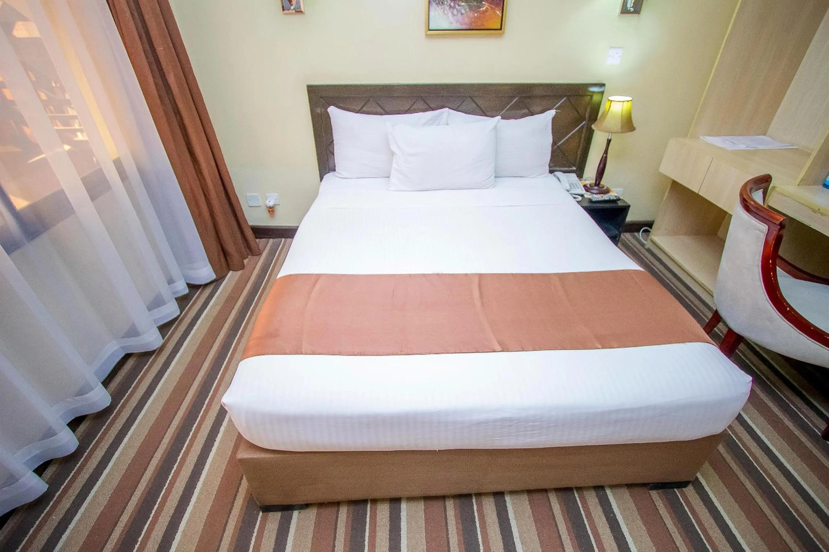 Bed in The Clarion Hotel