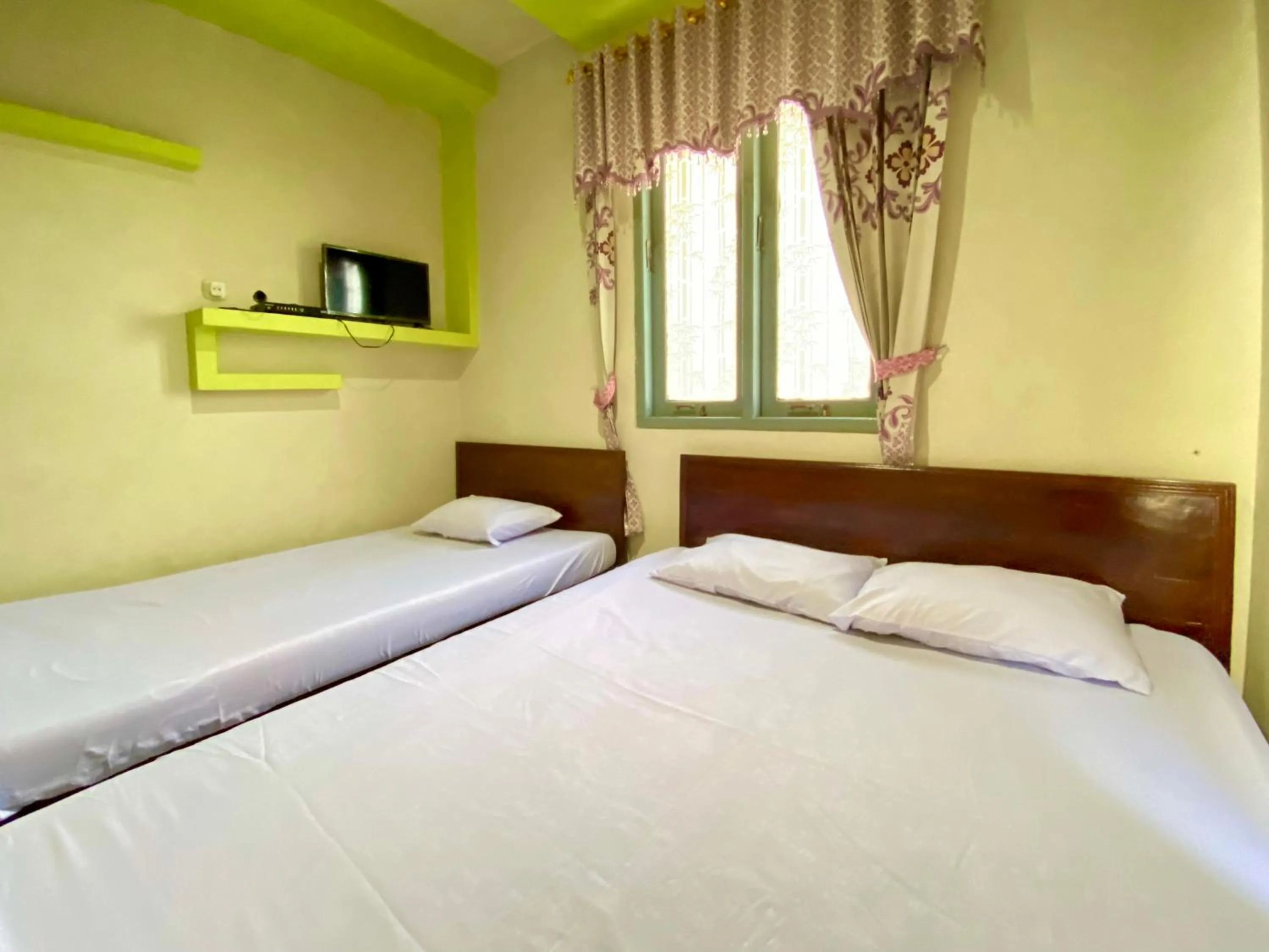 Bed in Homestay Srikandi Syariah Dieng RedPartner