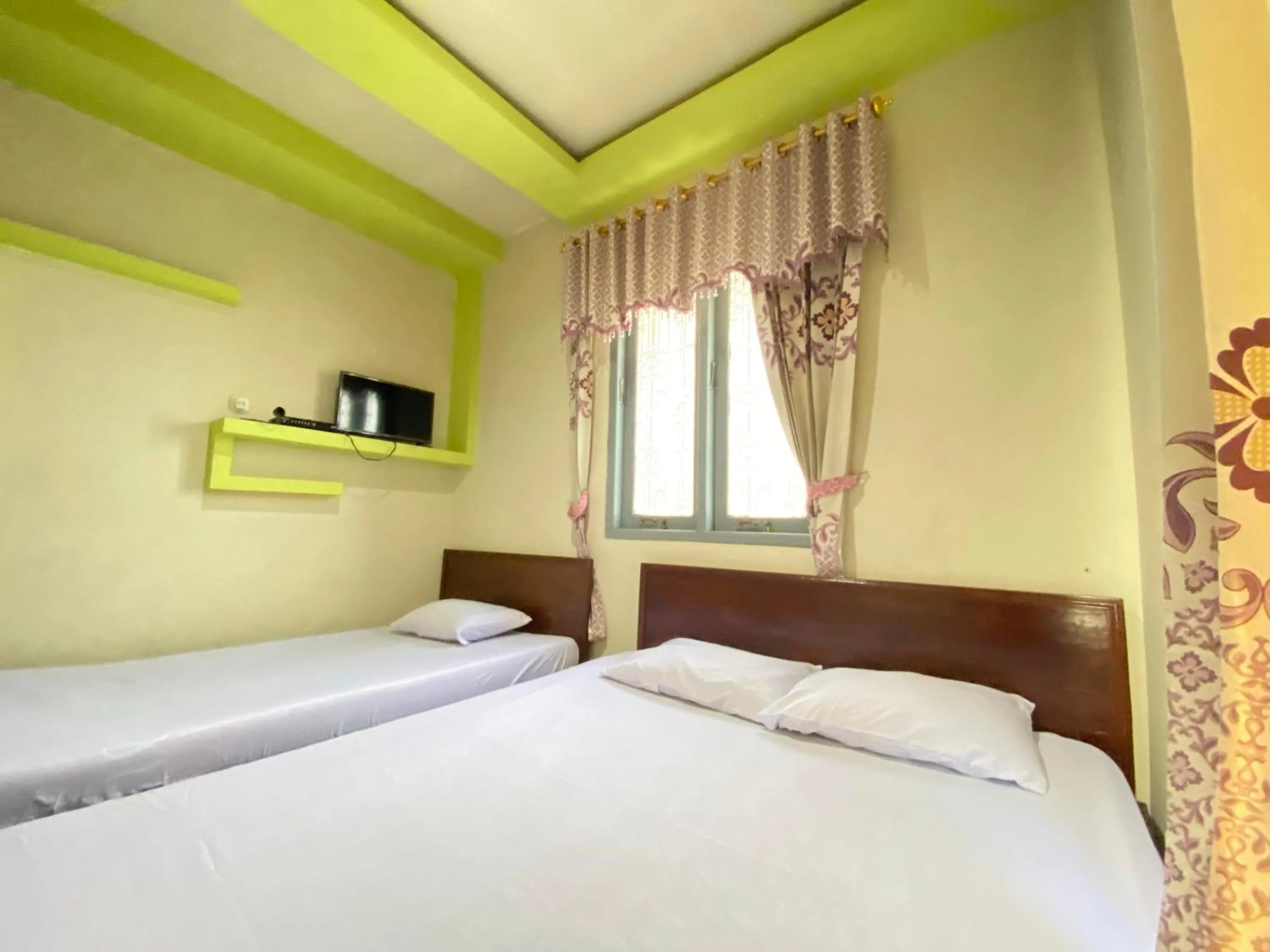 Bed in Homestay Srikandi Syariah Dieng RedPartner