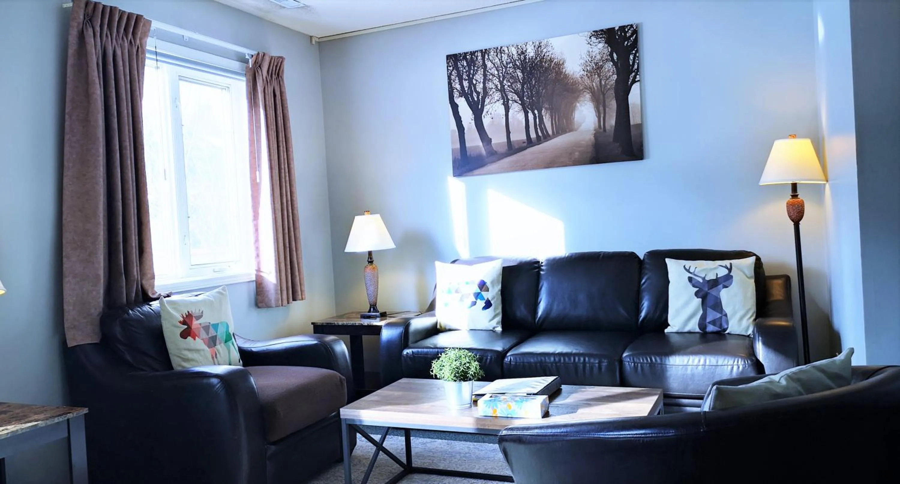 Living room in Canadian Rockies Chalets by Trilink - 2 & 3 Bedroom Condos - Self Check-In - Walking Distance to Downtown - Free Parking - Pet-Friendly - No AC