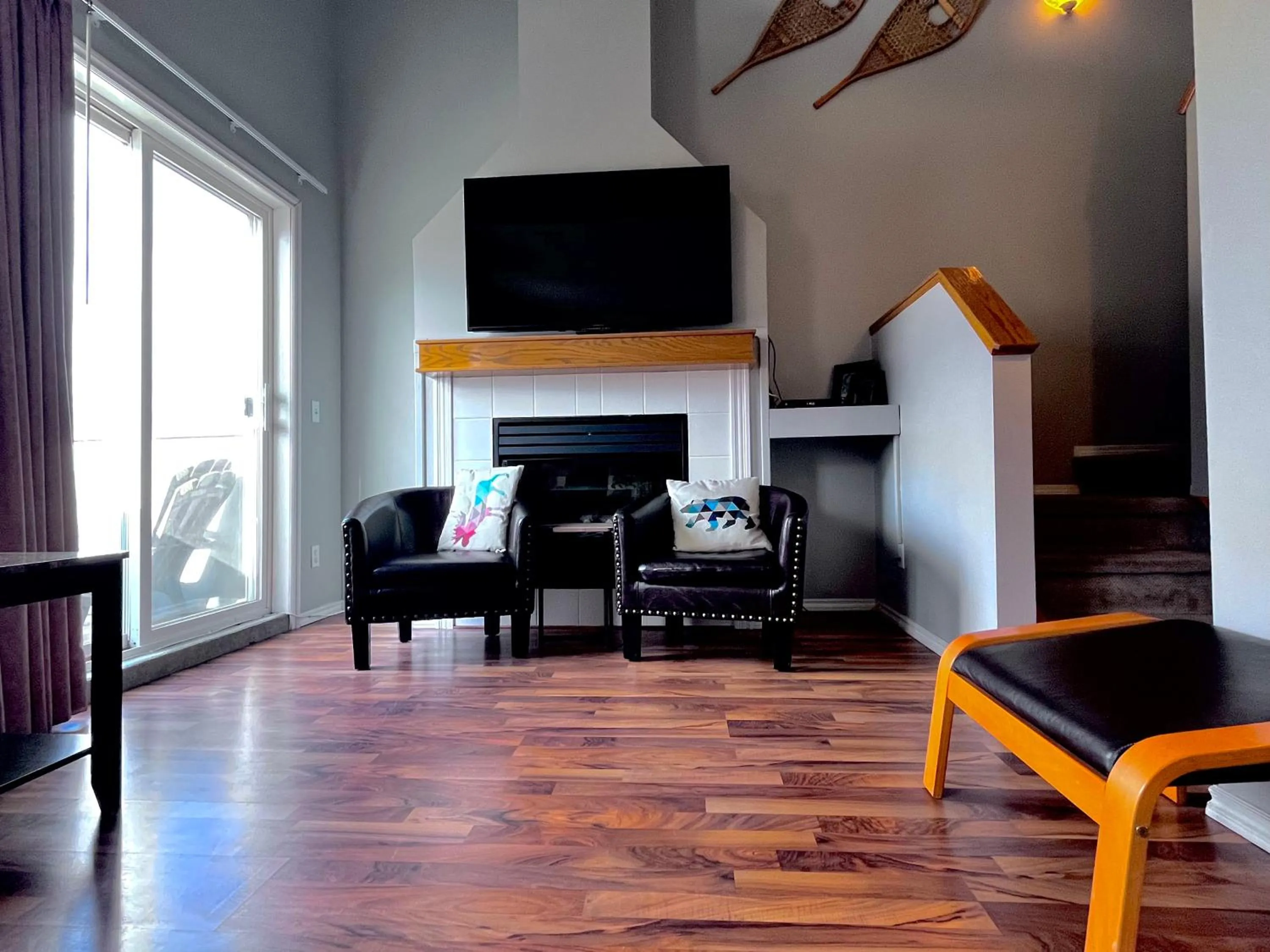 TV and multimedia in Canadian Rockies Chalets by Trilink - 2 & 3 Bedroom Condos - Self Check-In - Walking Distance to Downtown - Free Parking - Pet-Friendly - No AC