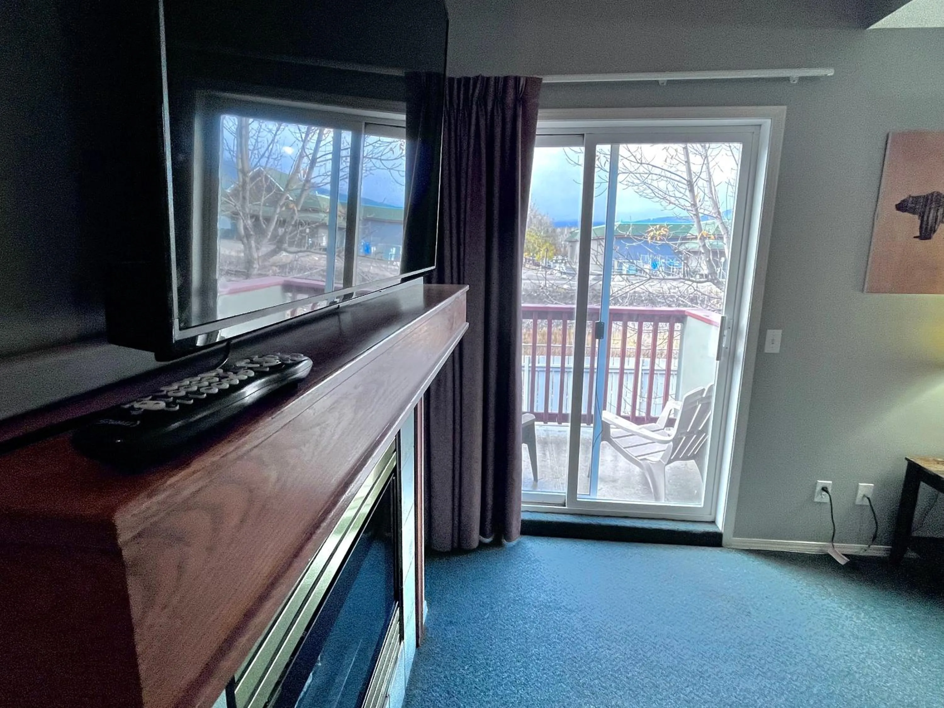 TV and multimedia in Canadian Rockies Chalets by Trilink - 2 & 3 Bedroom Condos - Self Check-In - Walking Distance to Downtown - Free Parking - Pet-Friendly - No AC