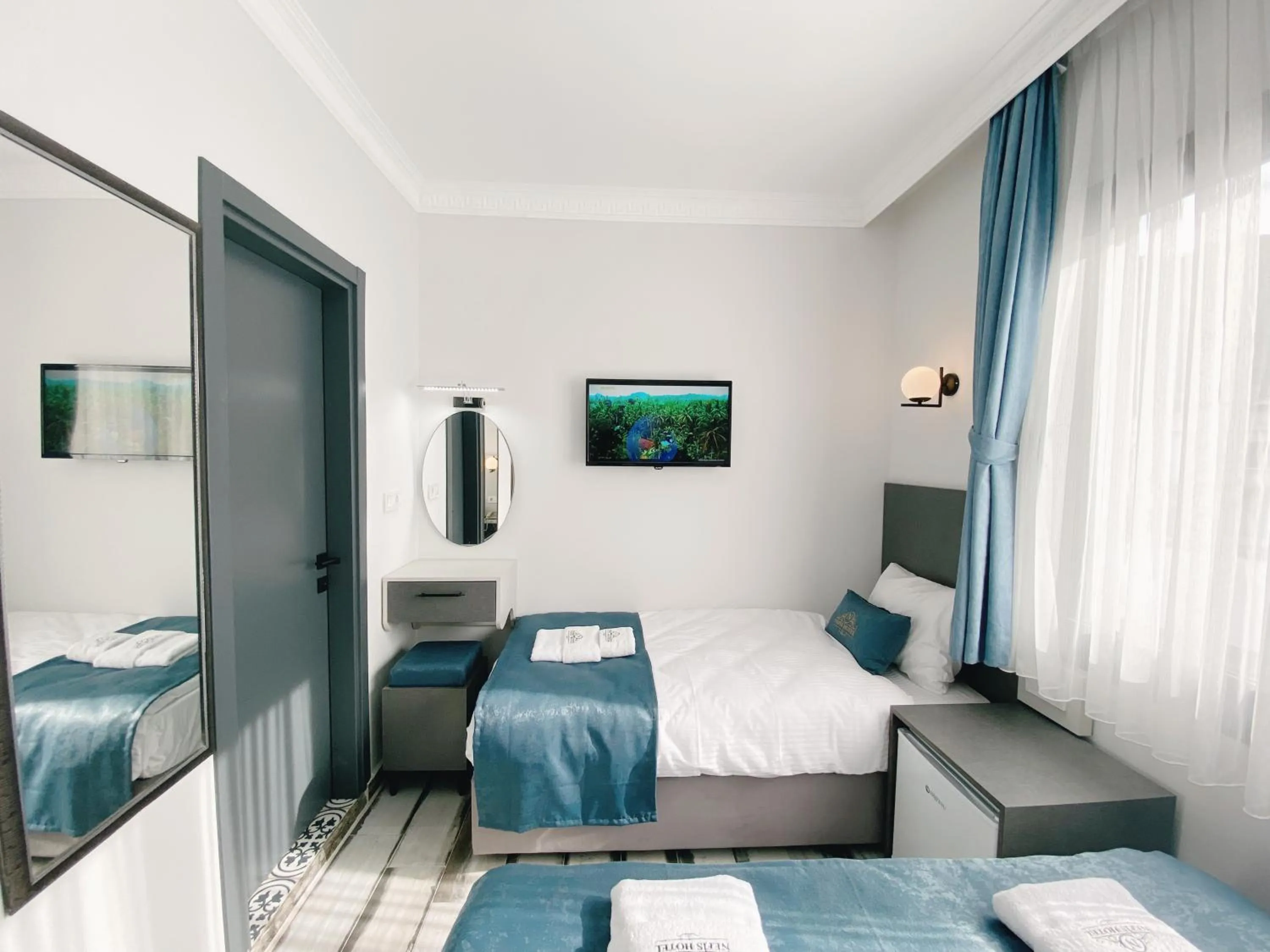 Bed in Nefis Hotel City