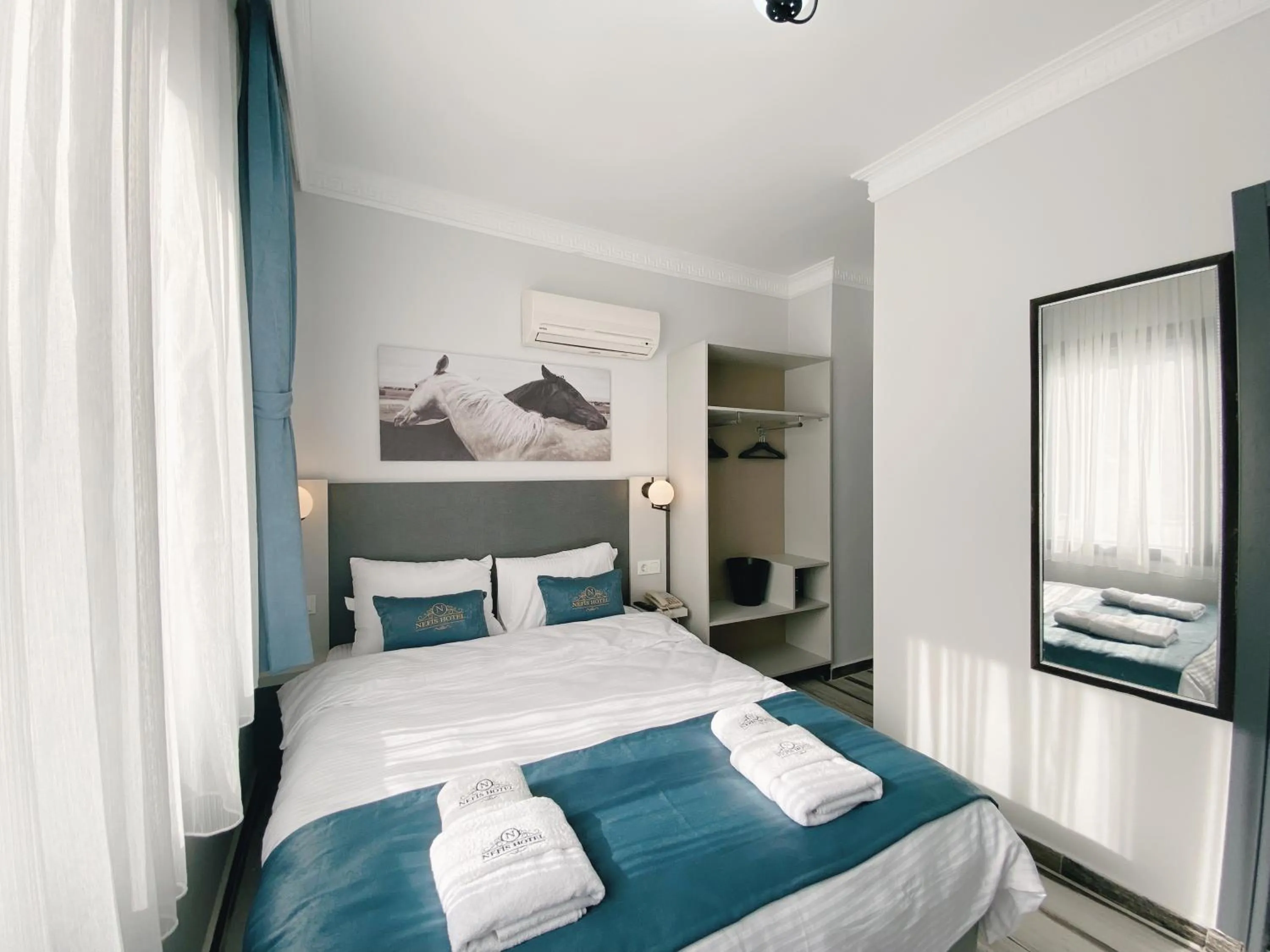 Bed in Nefis Hotel City