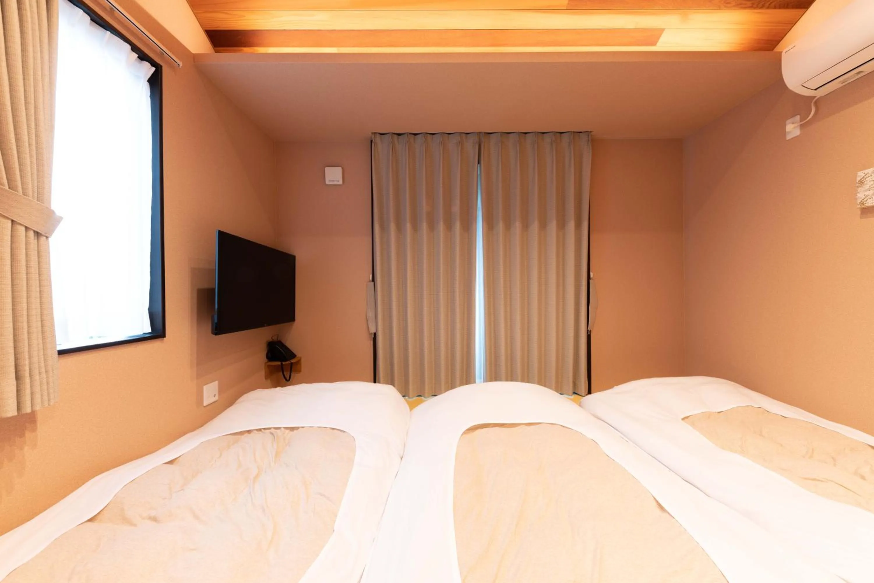 Bed in SYLA HOTEL 箱根強羅 West - SYLA HOTEL HAKONE GORA West