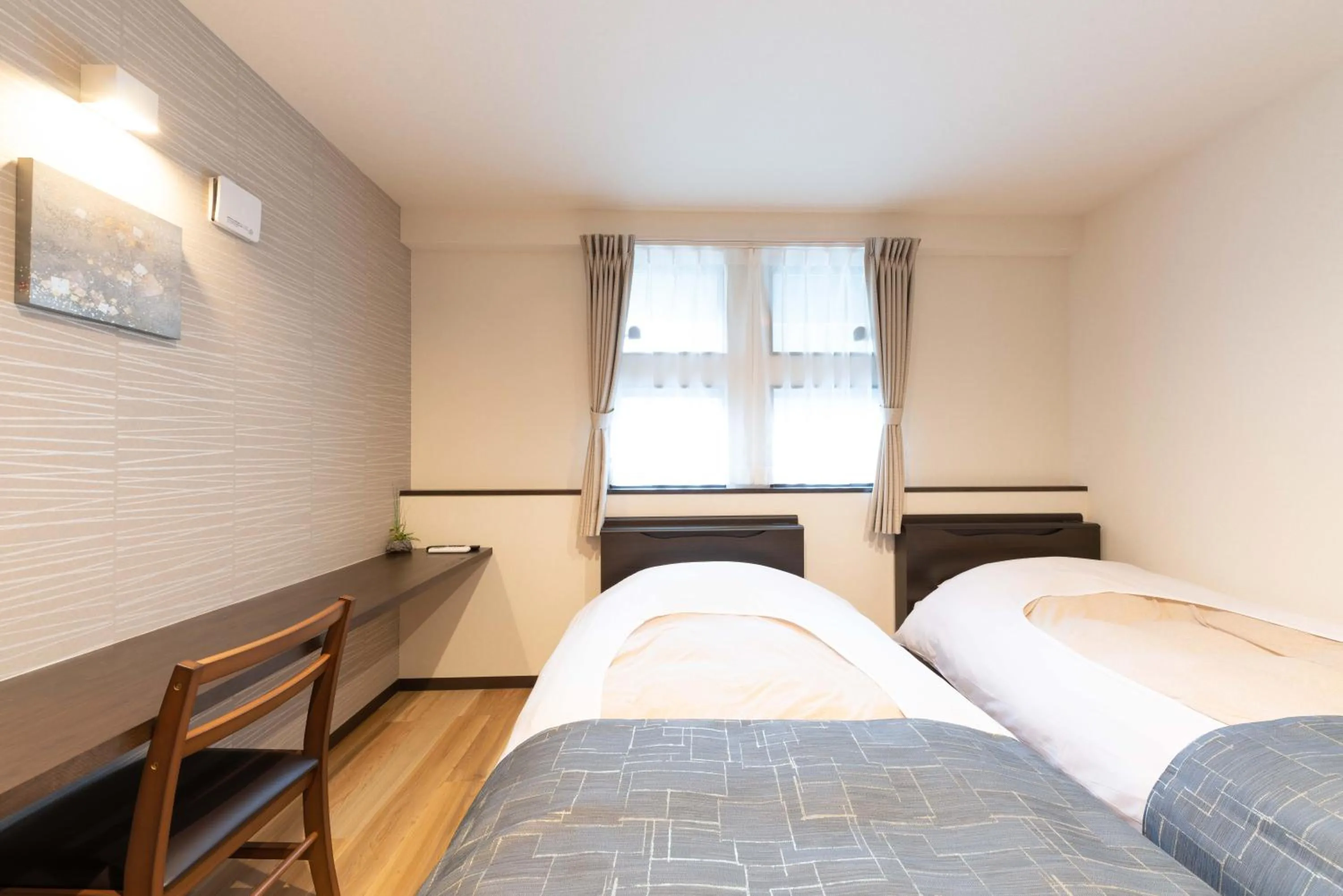 Bed in SYLA HOTEL 箱根強羅 West - SYLA HOTEL HAKONE GORA West