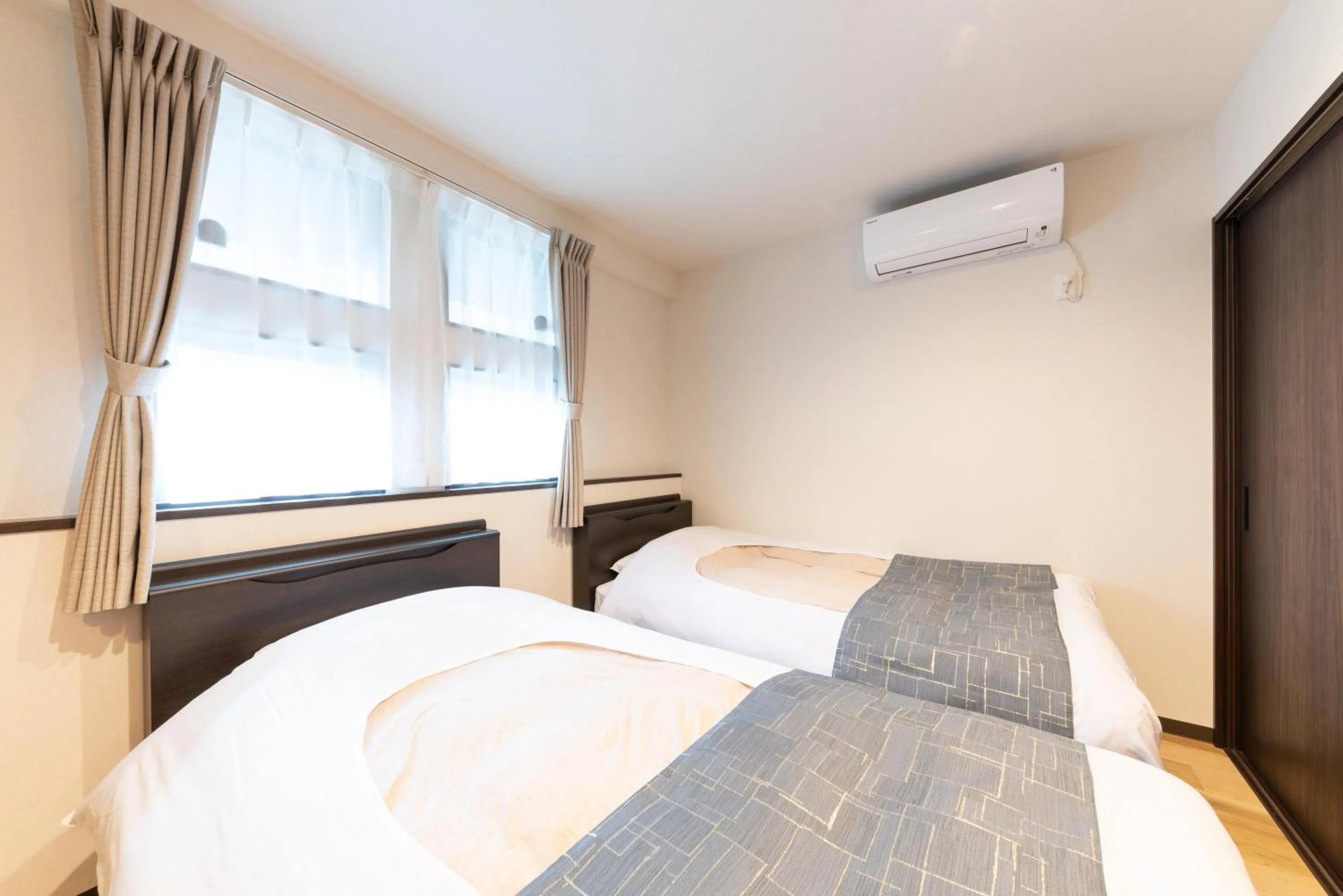 Bed in SYLA HOTEL 箱根強羅 West - SYLA HOTEL HAKONE GORA West