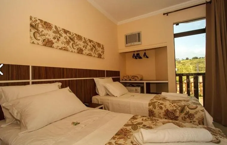 Photo of the whole room, Bed in Estrada Real Palace Hotel