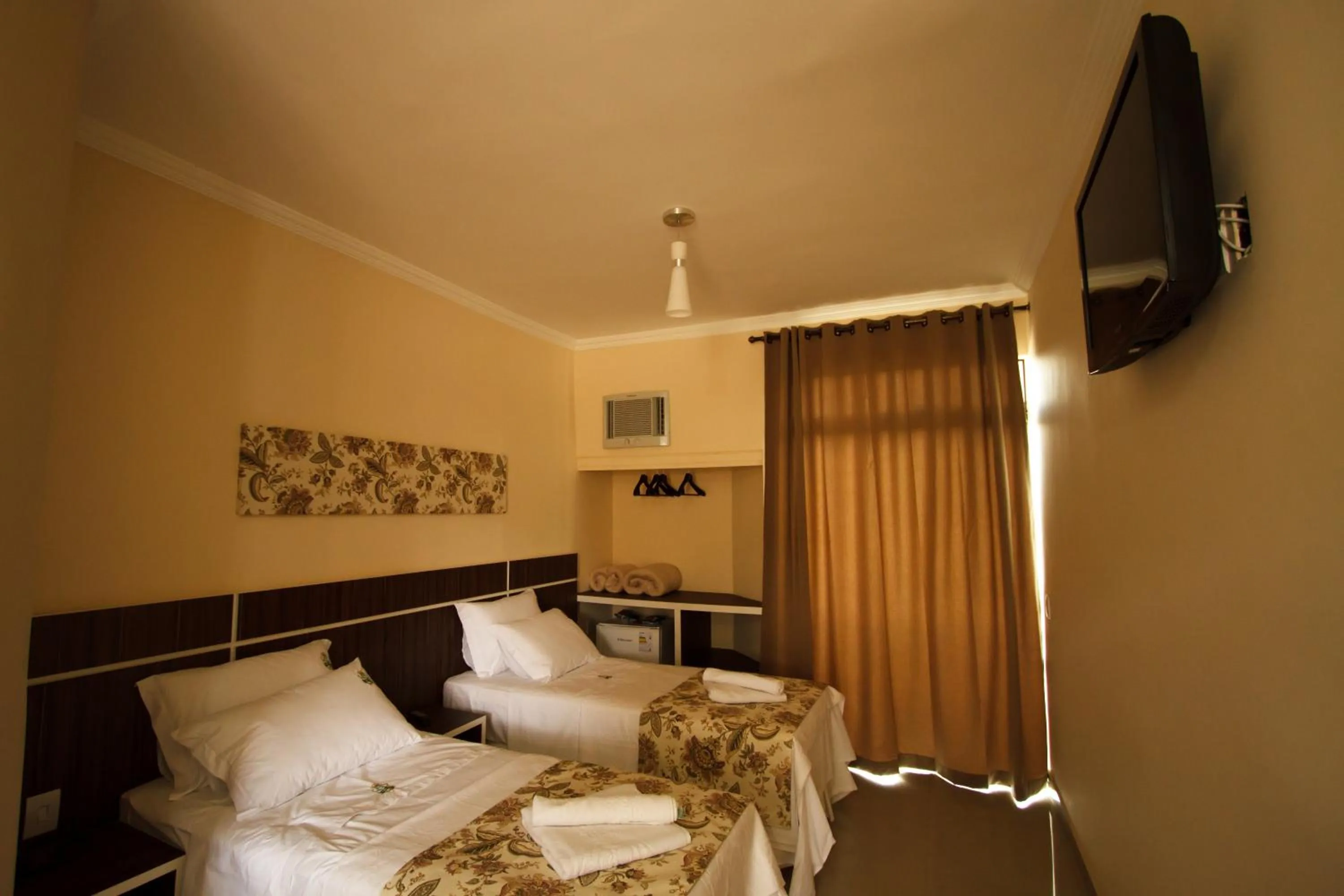 Bed in Estrada Real Palace Hotel