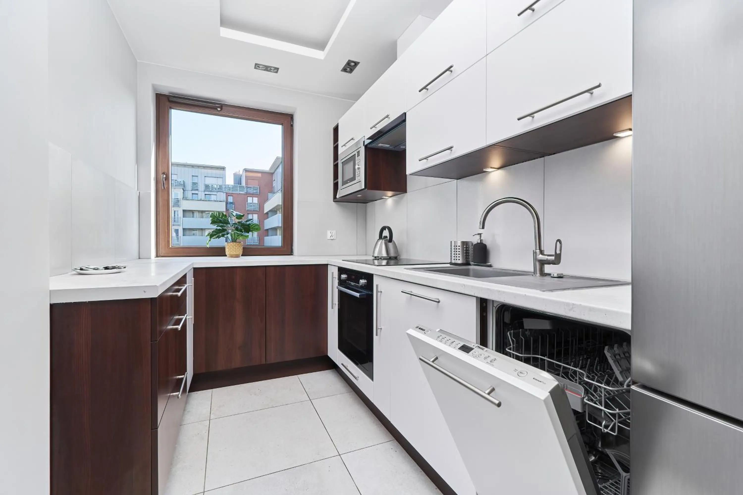 Kitchen or kitchenette in Nowa Tęczowa Apartments Promenada Staromiejska by Noclegi Renters