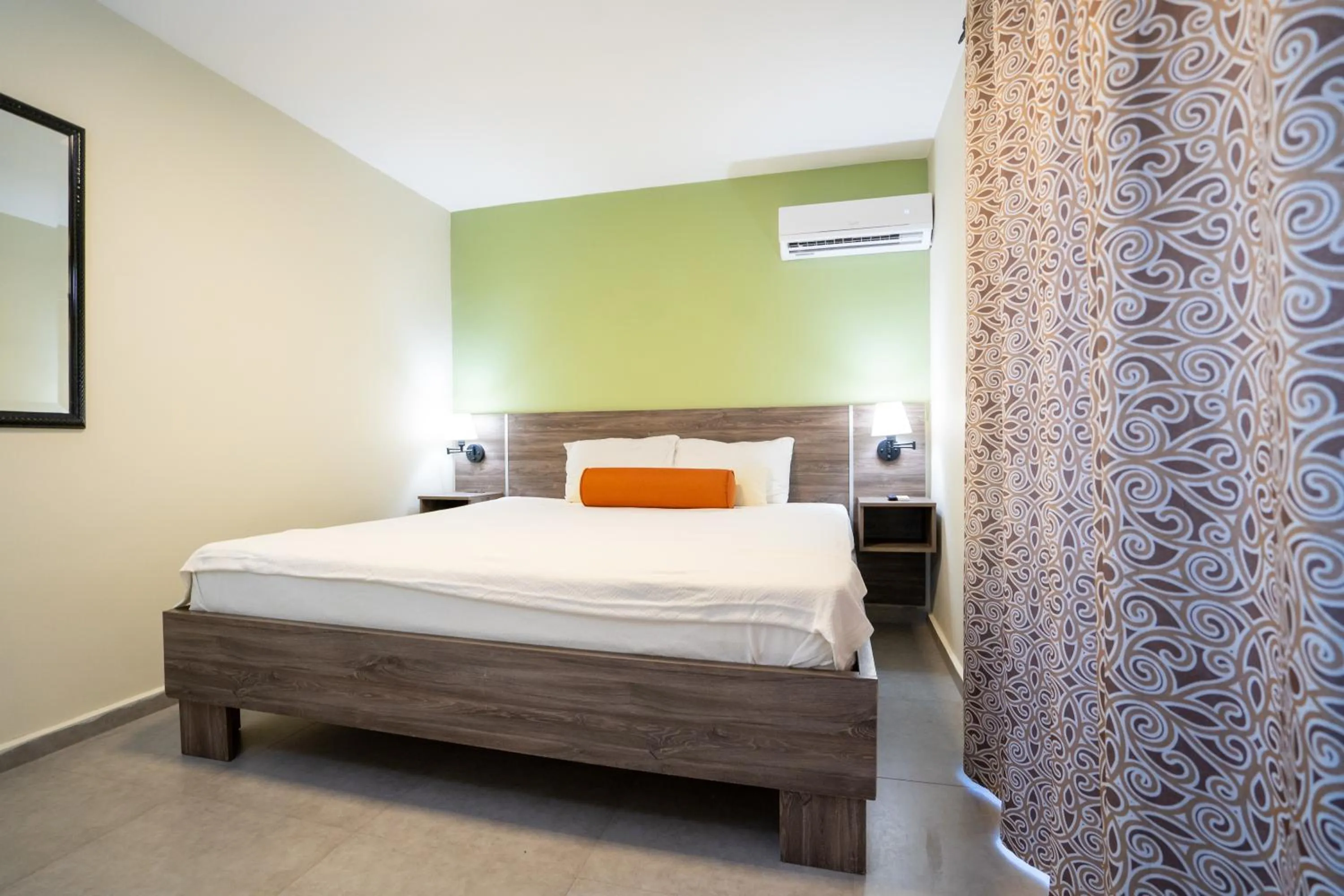 Bed in Delynne Boutique Hotel