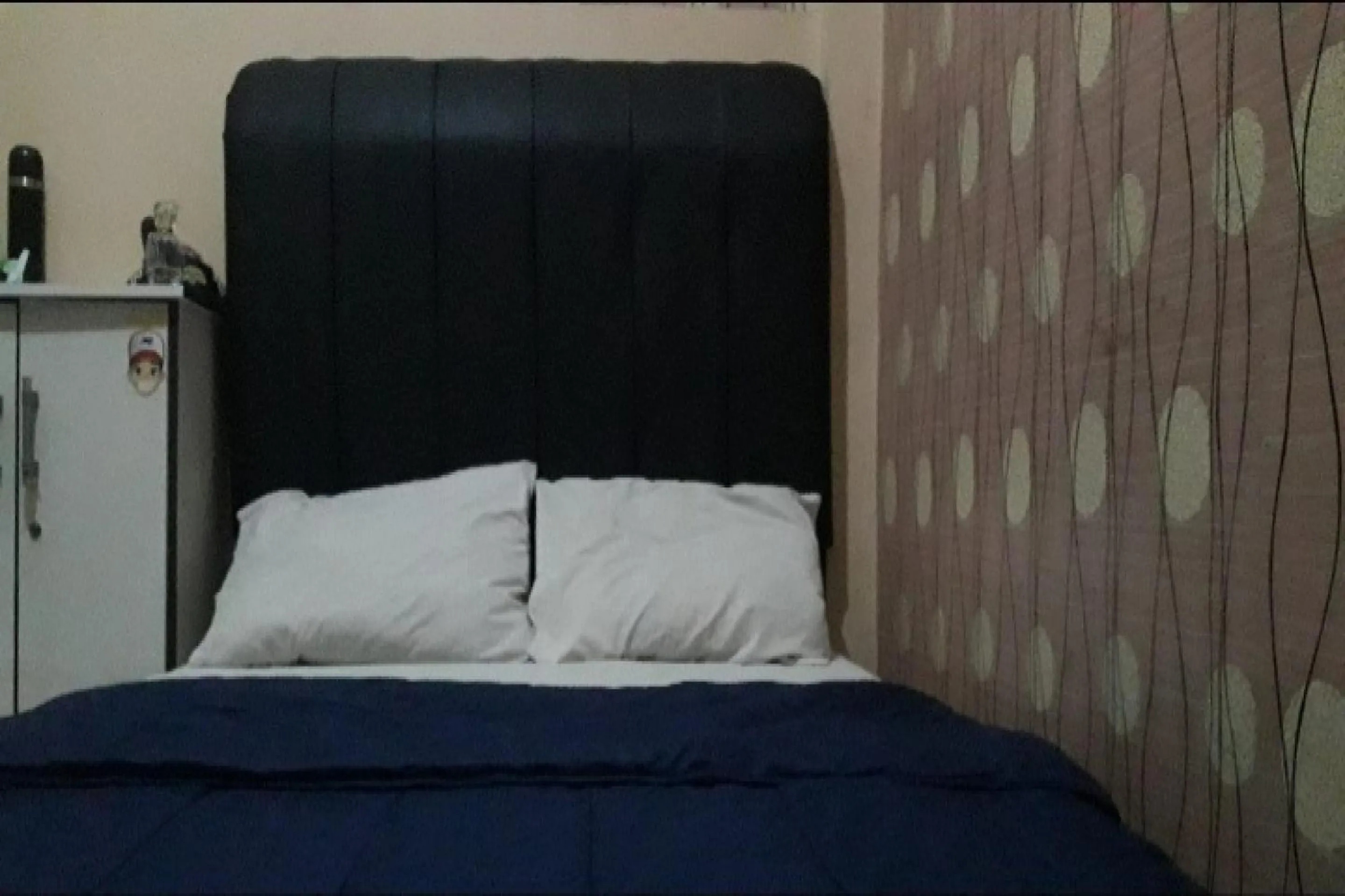 Bedroom in OYO 90706 Kost Alam Jaya Syariah