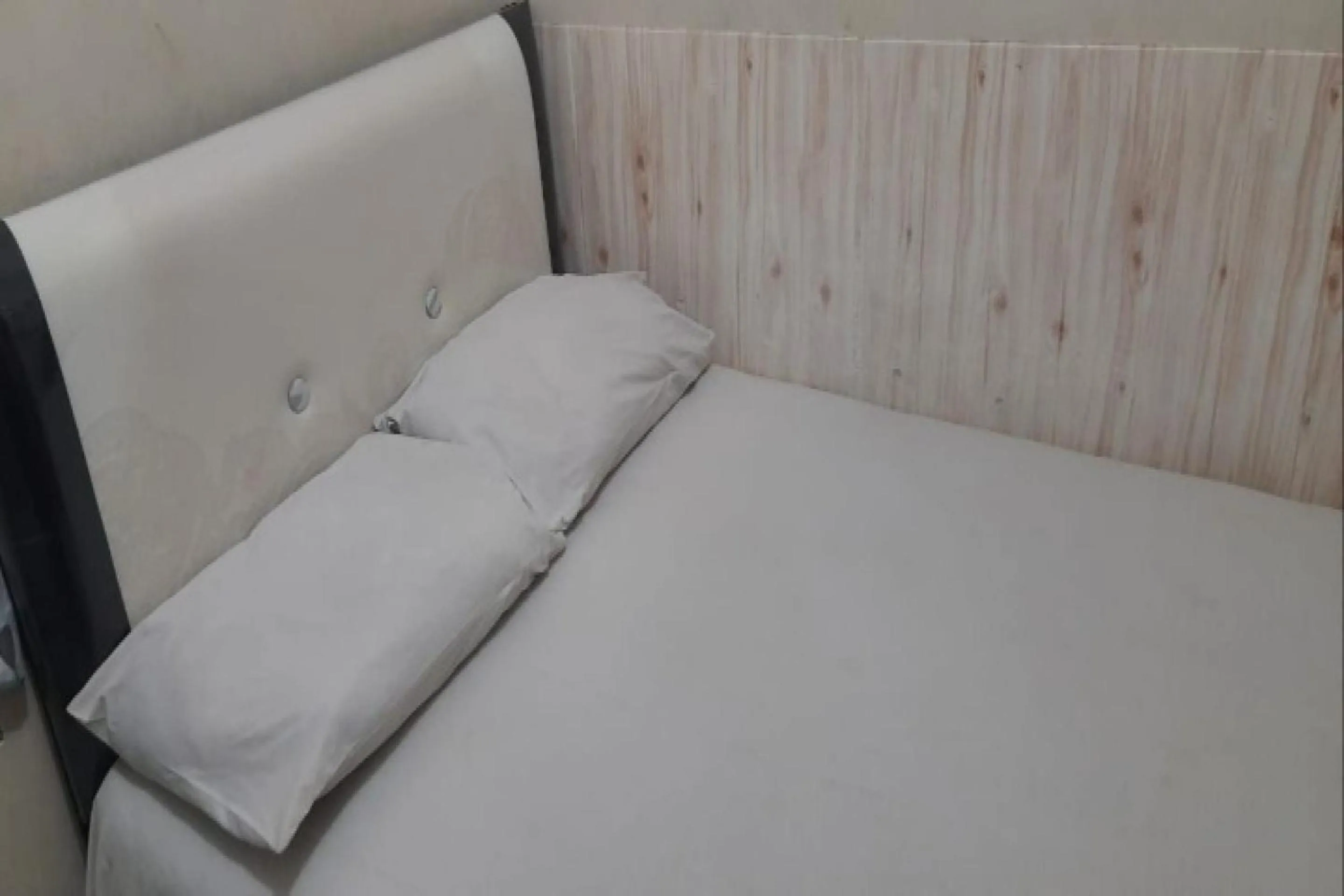 Bedroom in OYO 90706 Kost Alam Jaya Syariah