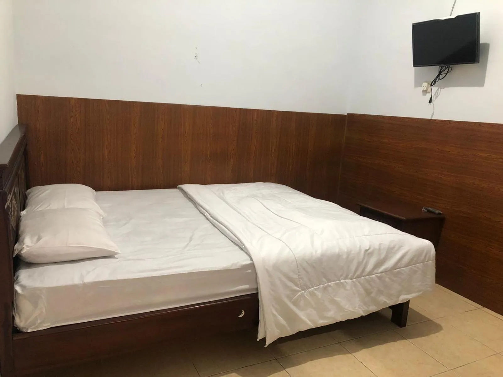 Bedroom in Anind Guest House near Museum Angkut Batu RedPartner