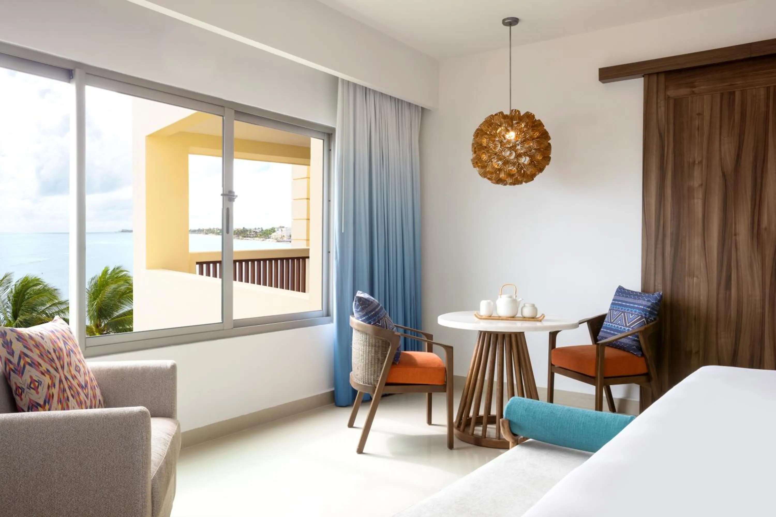 Seating area, Bed in Dreams Puerto Morelos Resort & Spa - All Inclusive