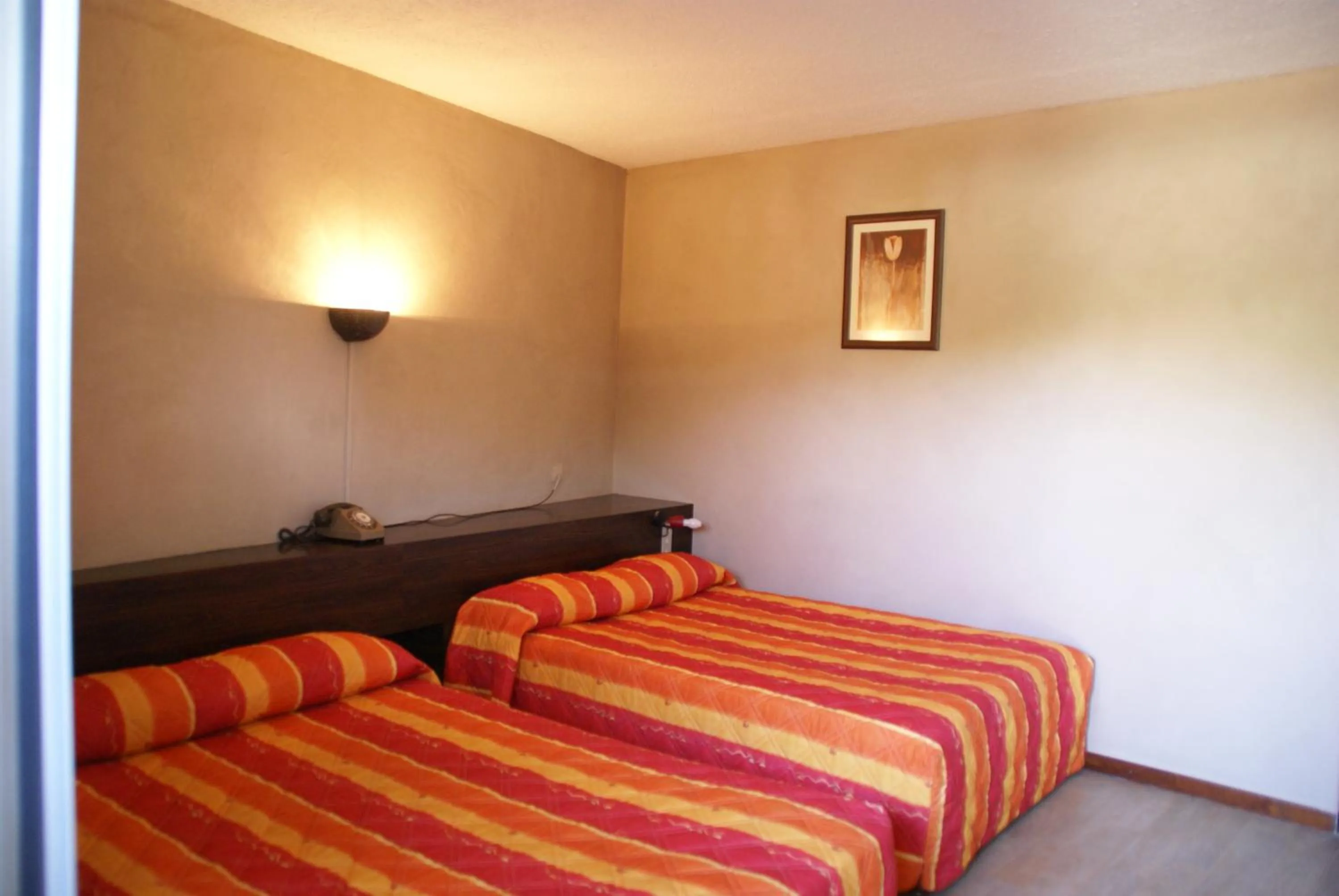 Bed in Hotel Le Lagon