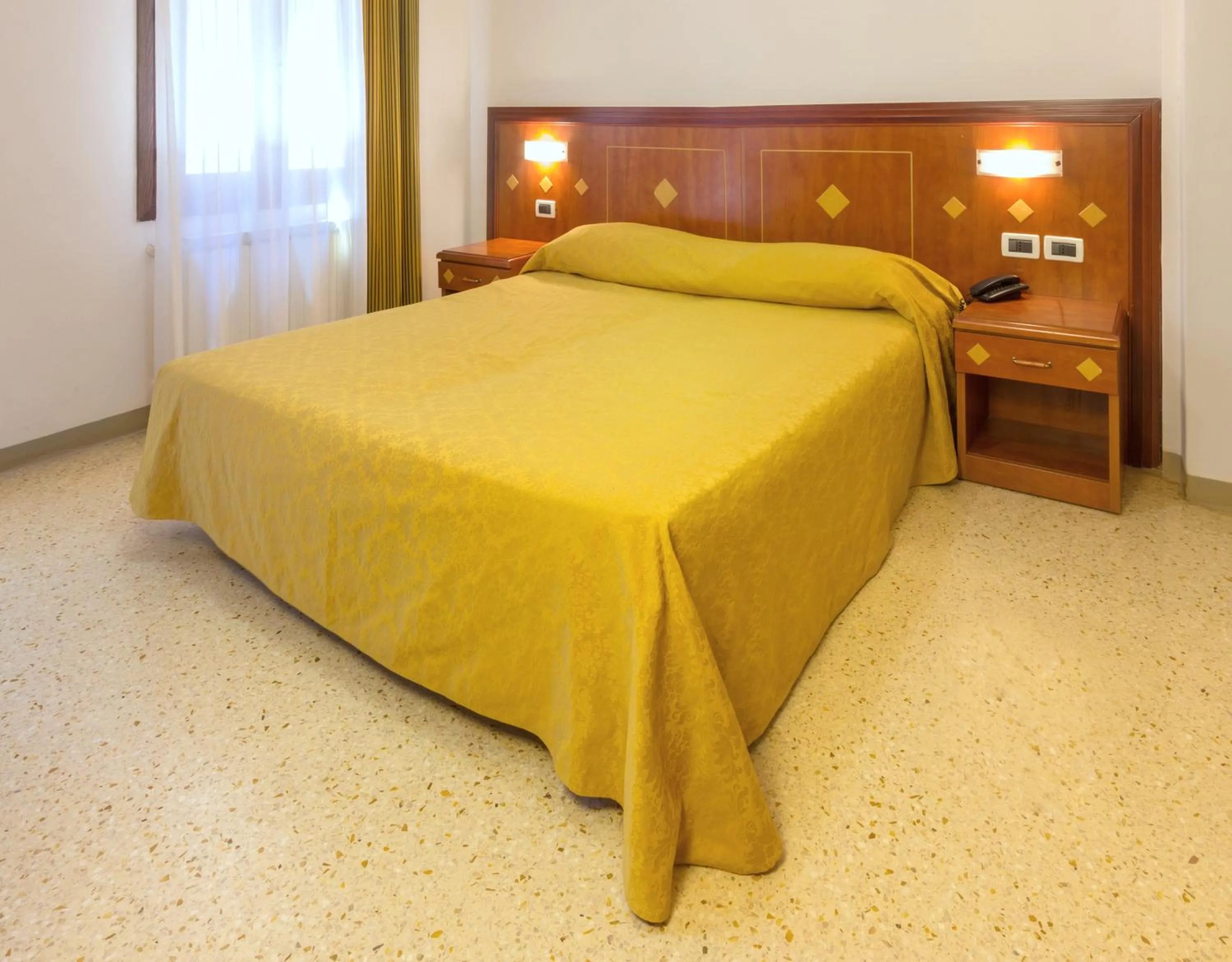 Bed in Hotel Adriatico
