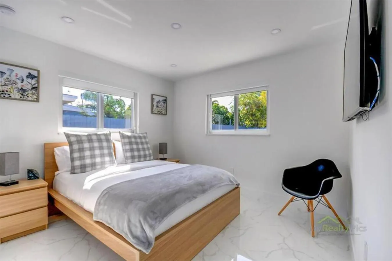 Bedroom in Magical Miami Retreat with Heated Pool, Mini Golf, and Basketball Court L19