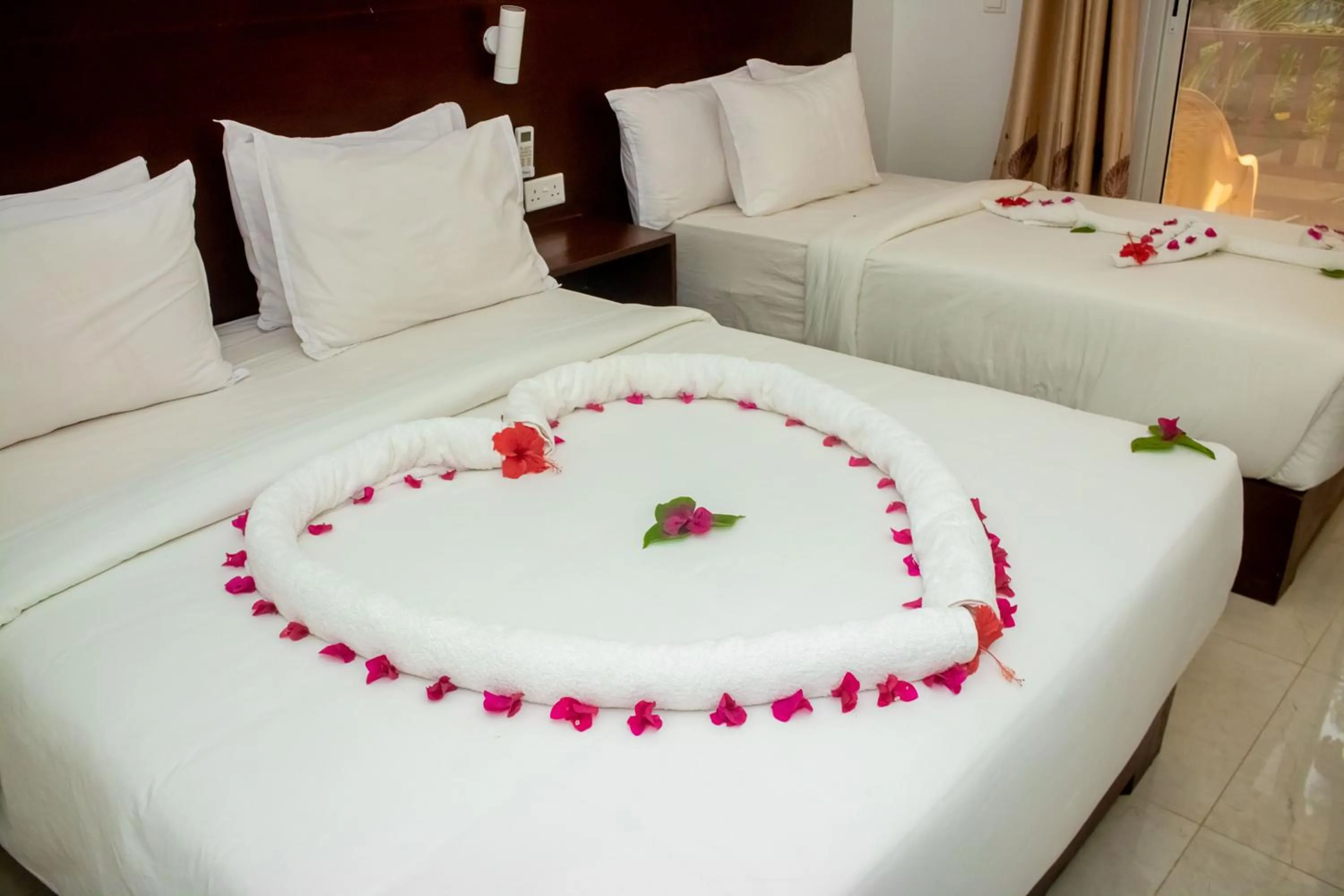 Bed in Malika Nungwi Hotel