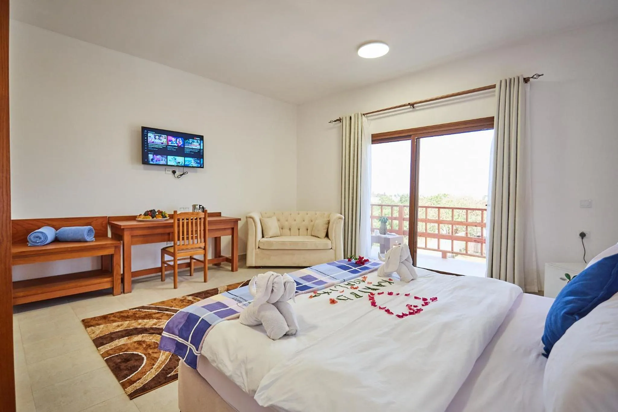 TV and multimedia, Bed in Malika Nungwi Hotel