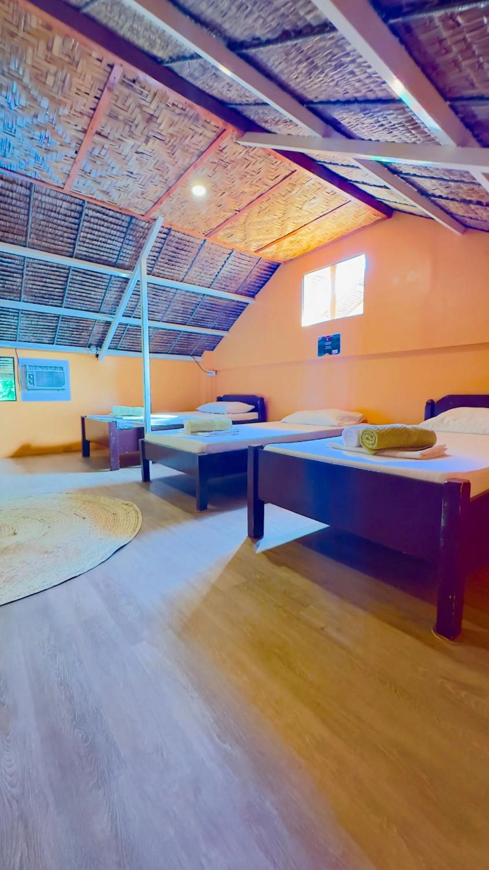 Bed in In Dai Aquasports and Beach Resort