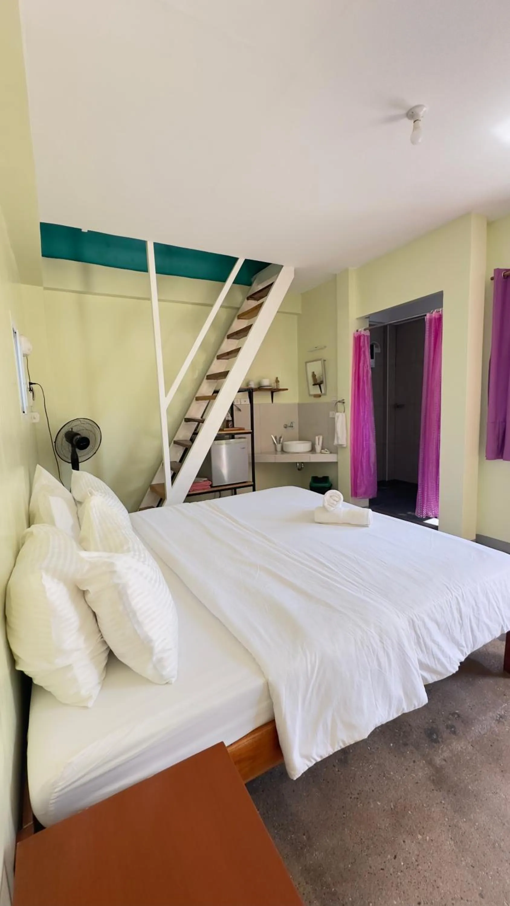 Bed in In Dai Aquasports and Beach Resort