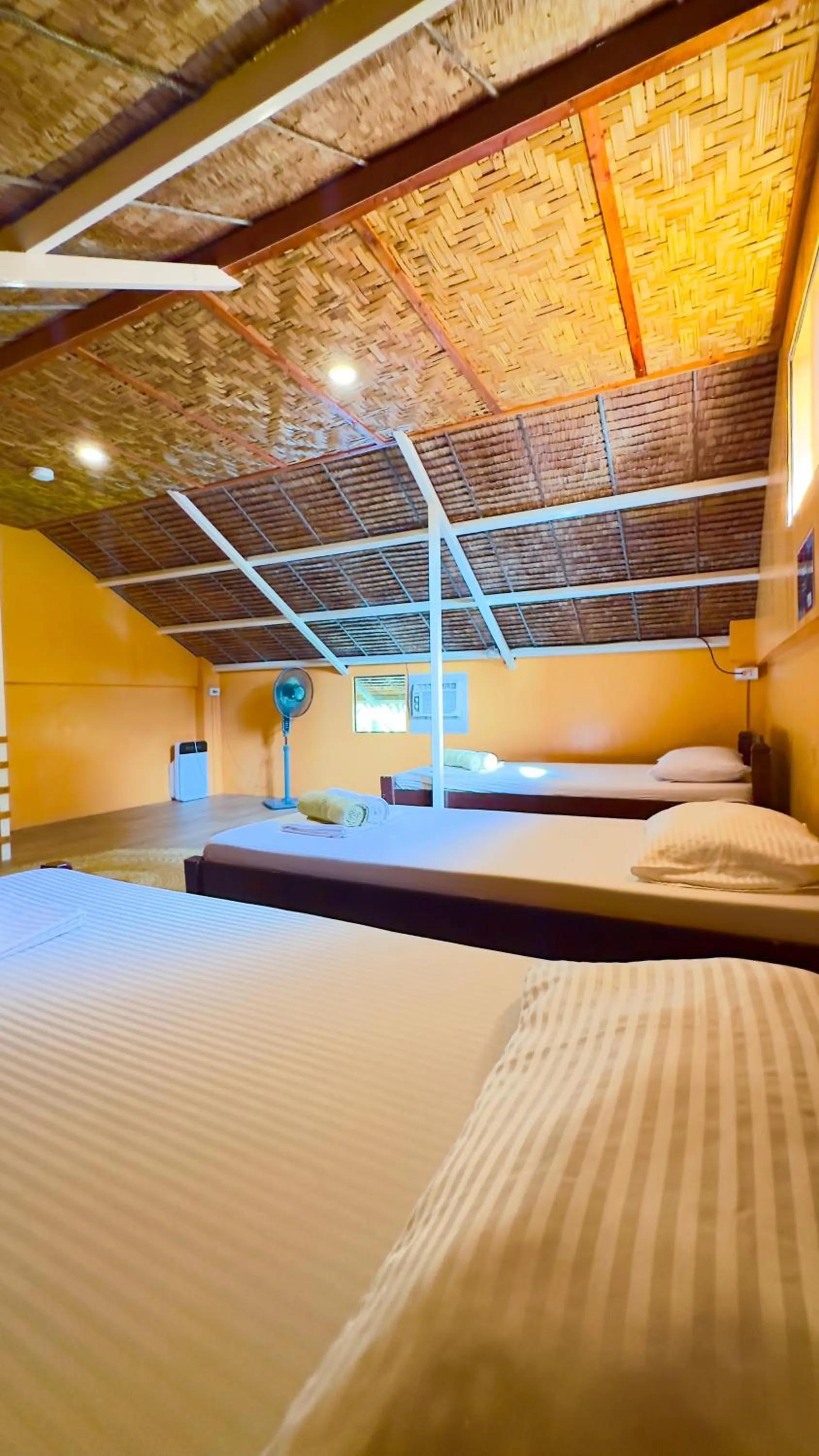 Bed in In Dai Aquasports and Beach Resort