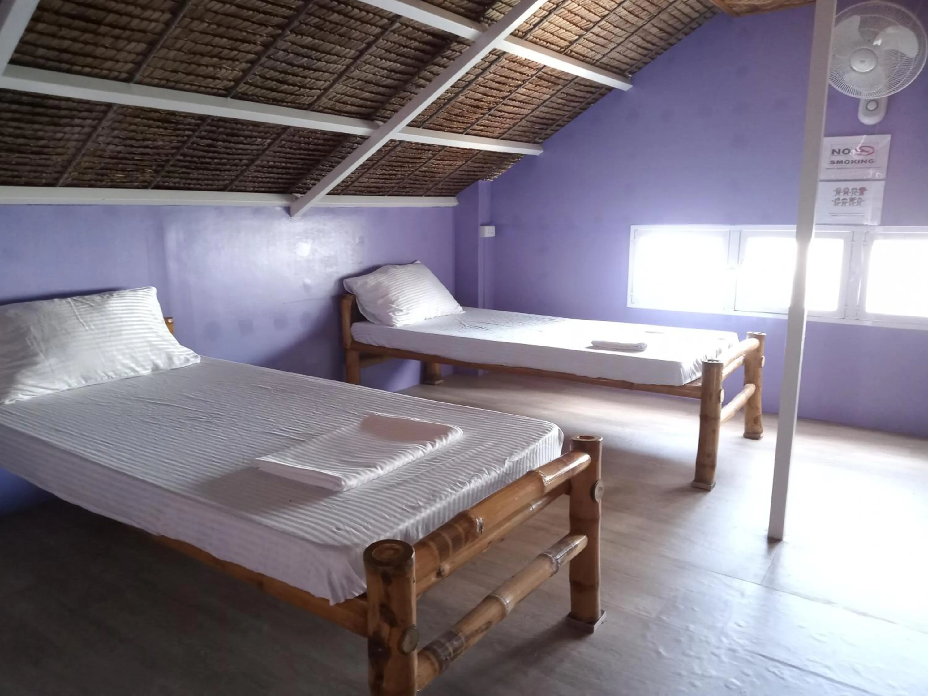 Bed in In Dai Aquasports and Beach Resort