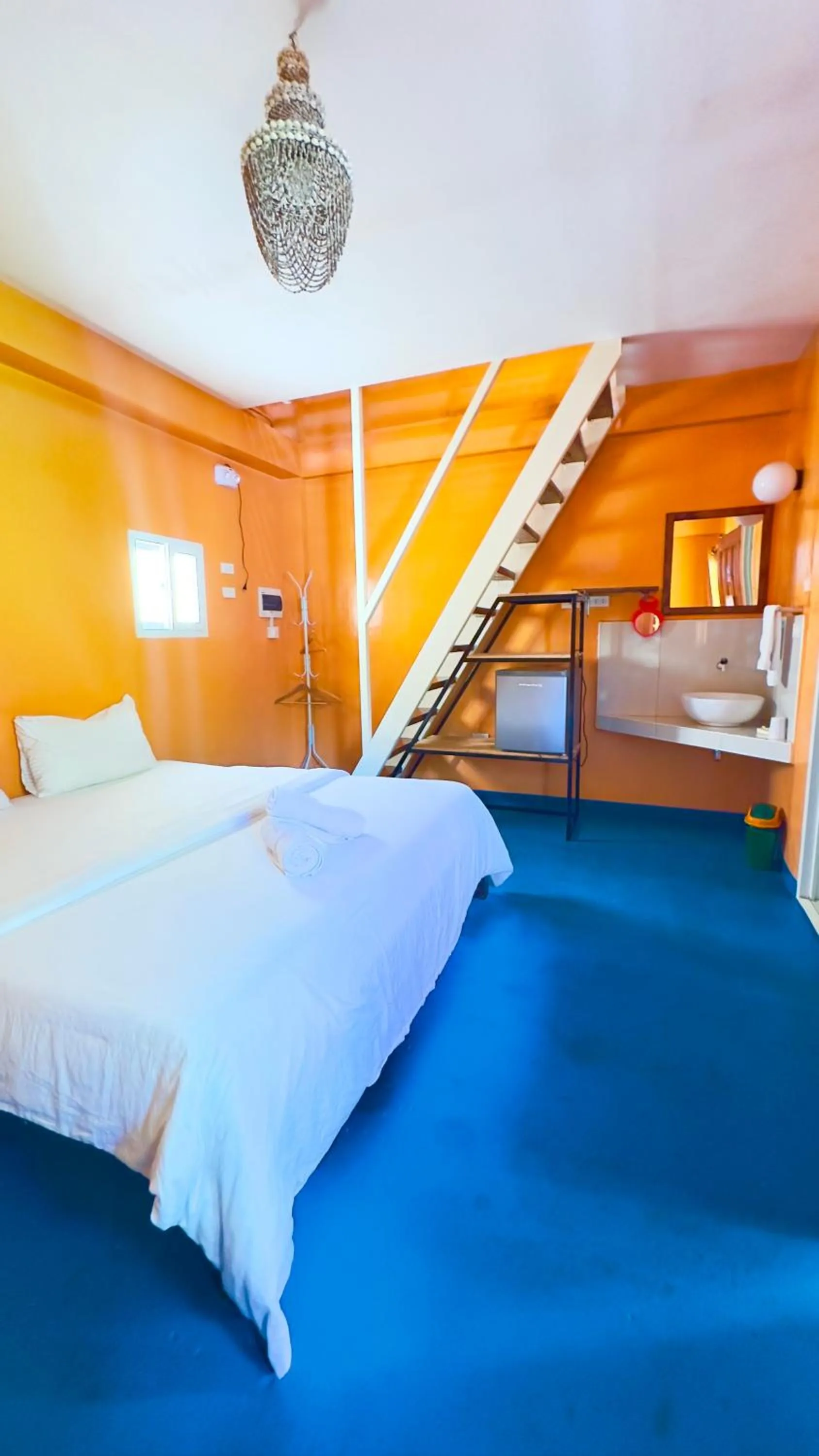 Bed in In Dai Aquasports and Beach Resort