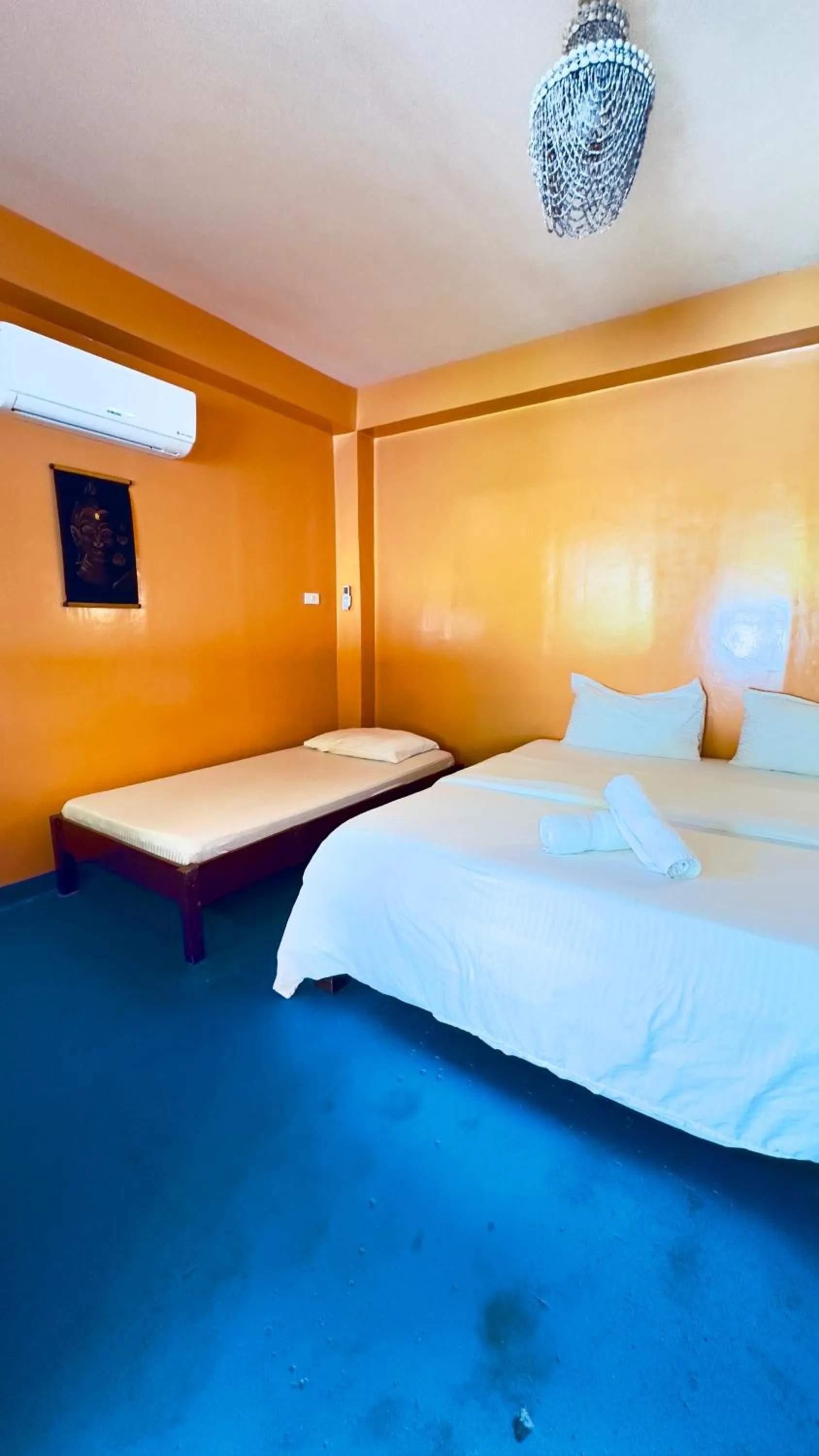 Bed in In Dai Aquasports and Beach Resort