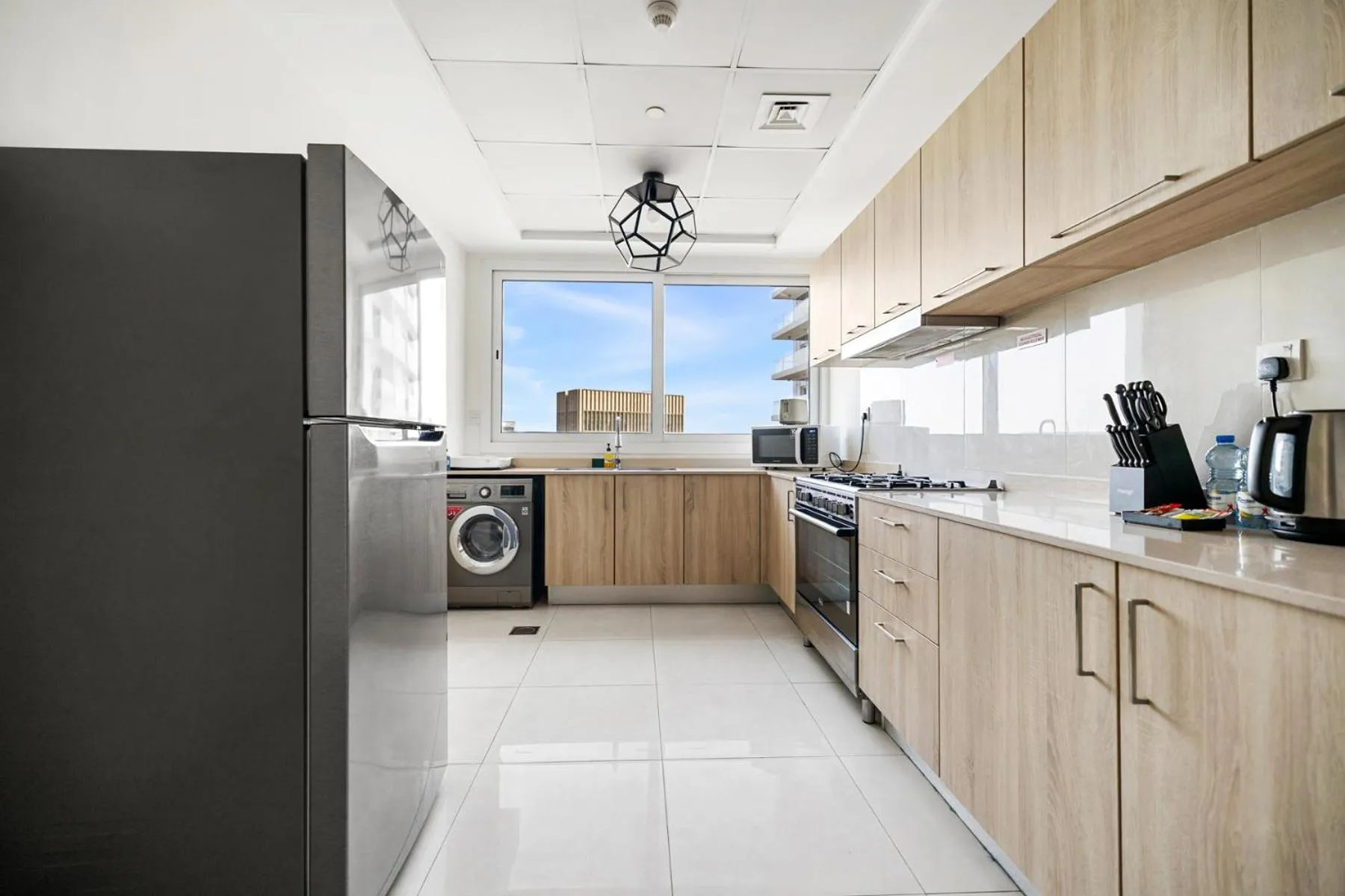 Kitchen or kitchenette in Unlock Metropolis Business Bay