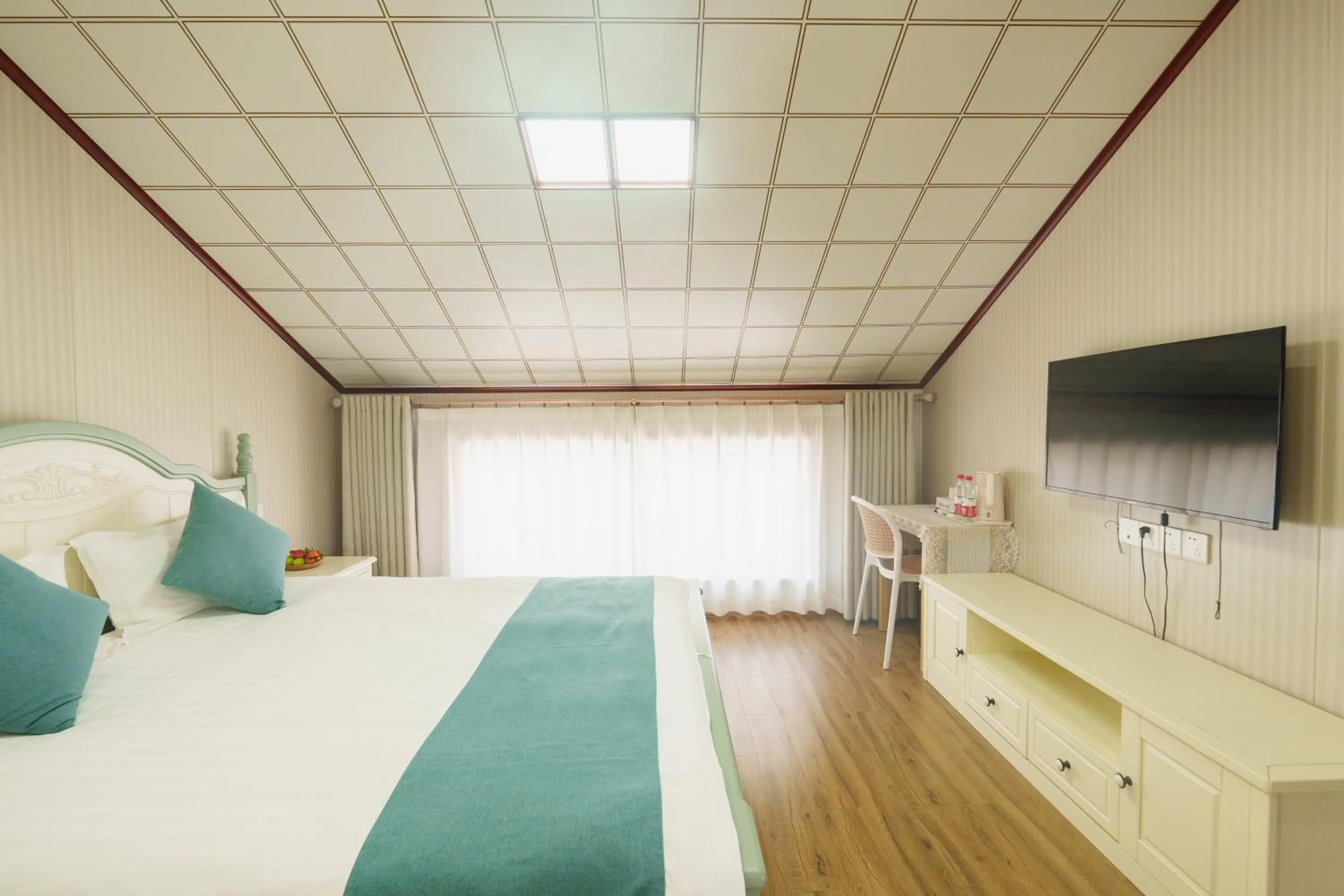 Bed in Floral Yilanxuan Zhouzhuang Hotel