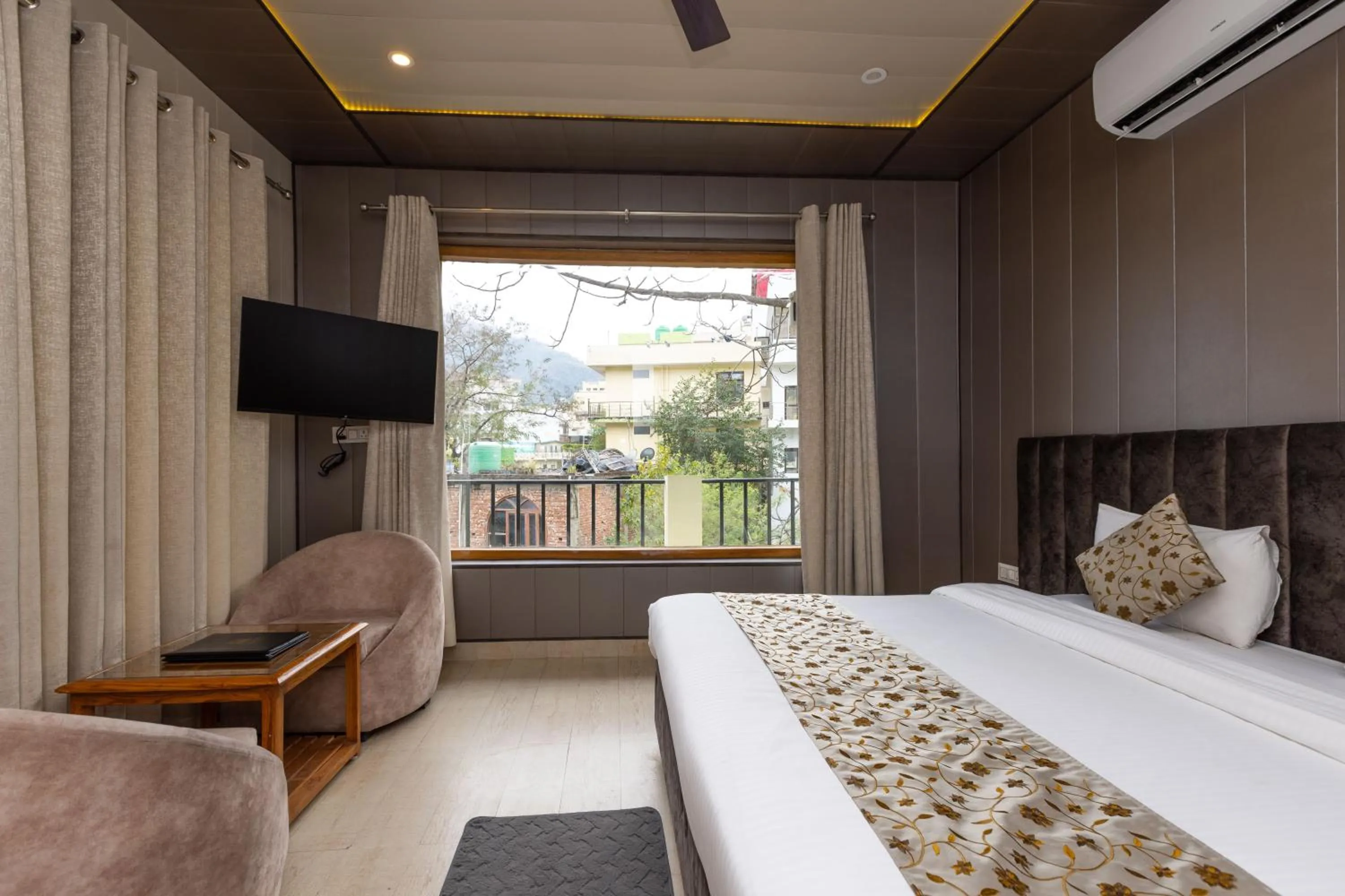 Communal lounge/ TV room, Bed in Yogved Hospitality & Resort