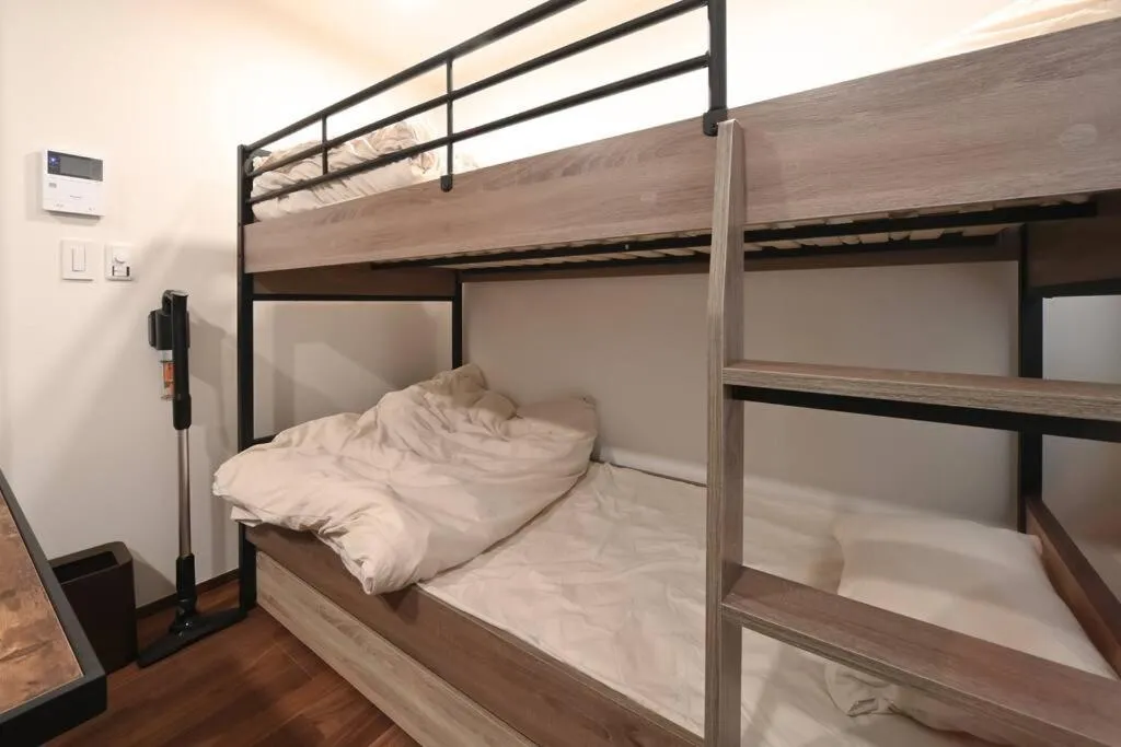 Bed in Stylewood Nishi-Shinjuku by Tranova