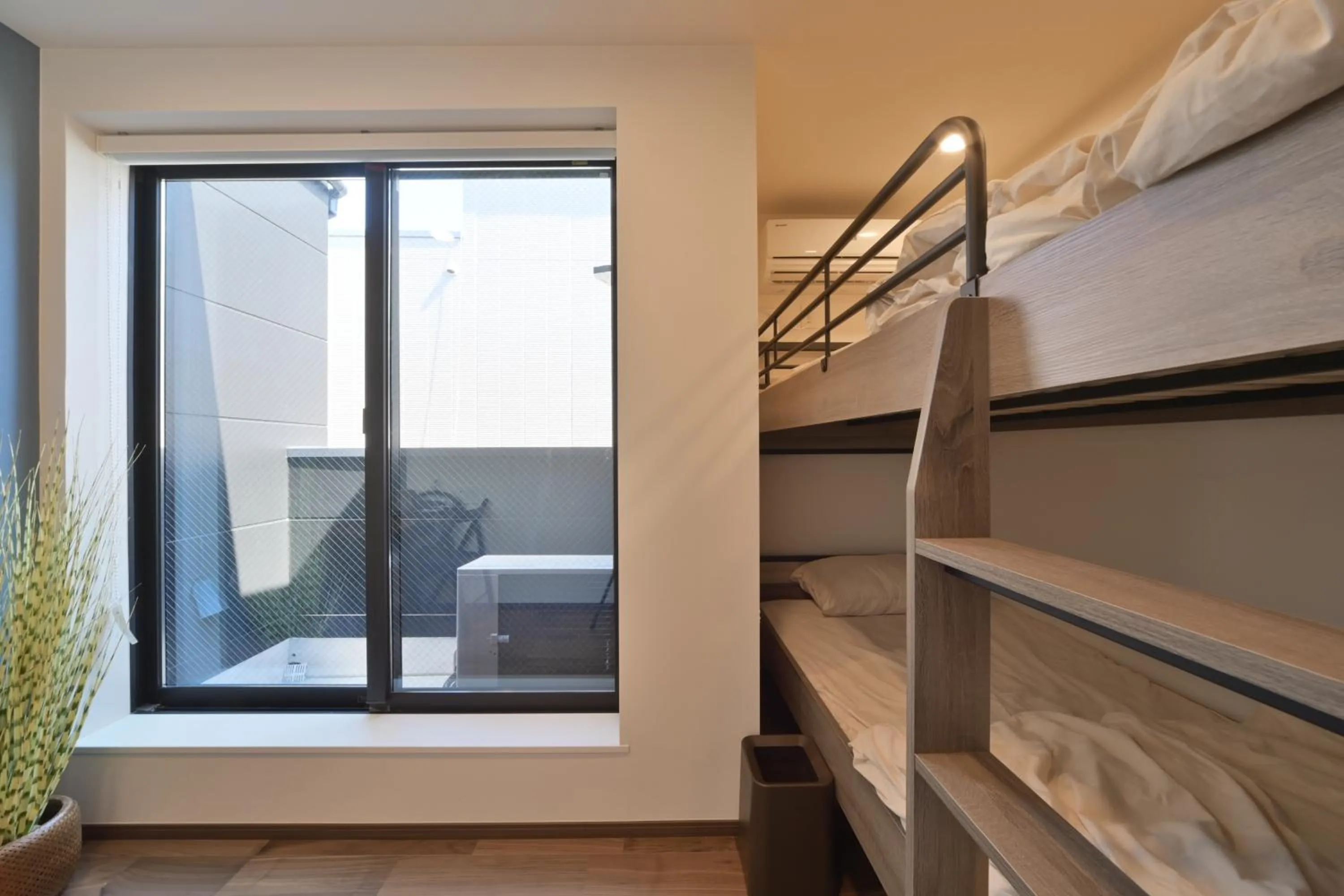 Bed in Stylewood Nishi-Shinjuku by Tranova