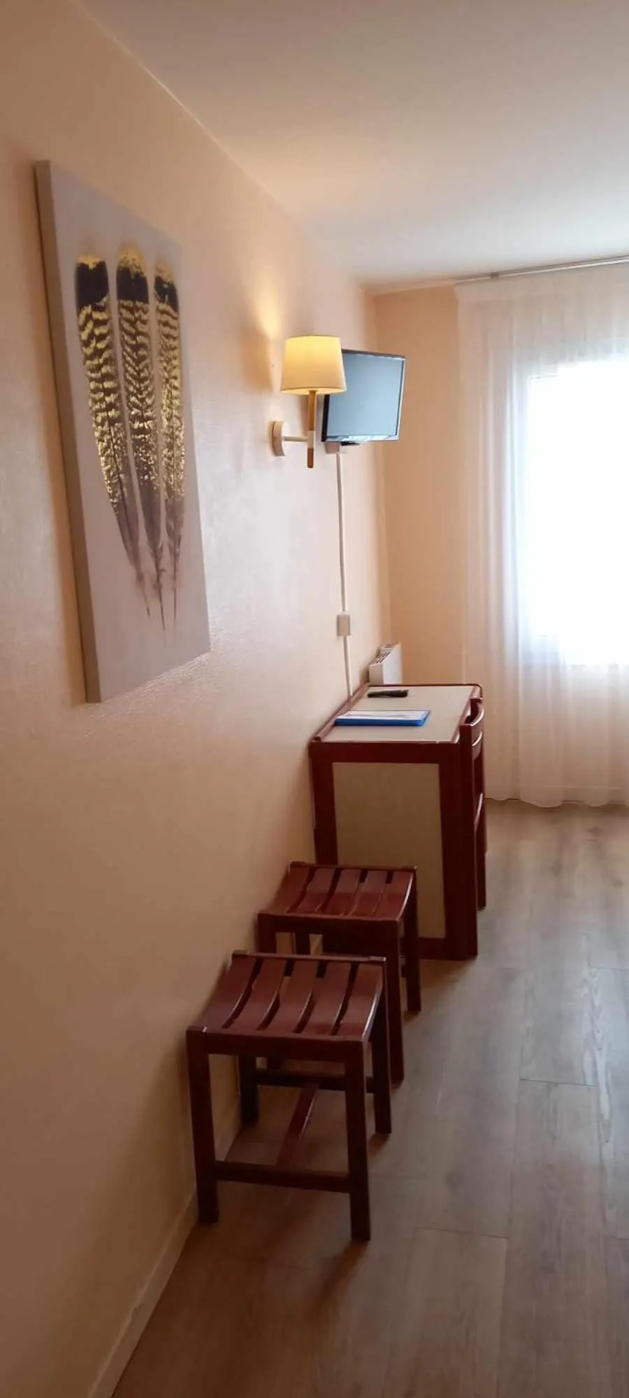 Bedroom in Hôtel SABLES D'O et son restaurant LE 16 BIS