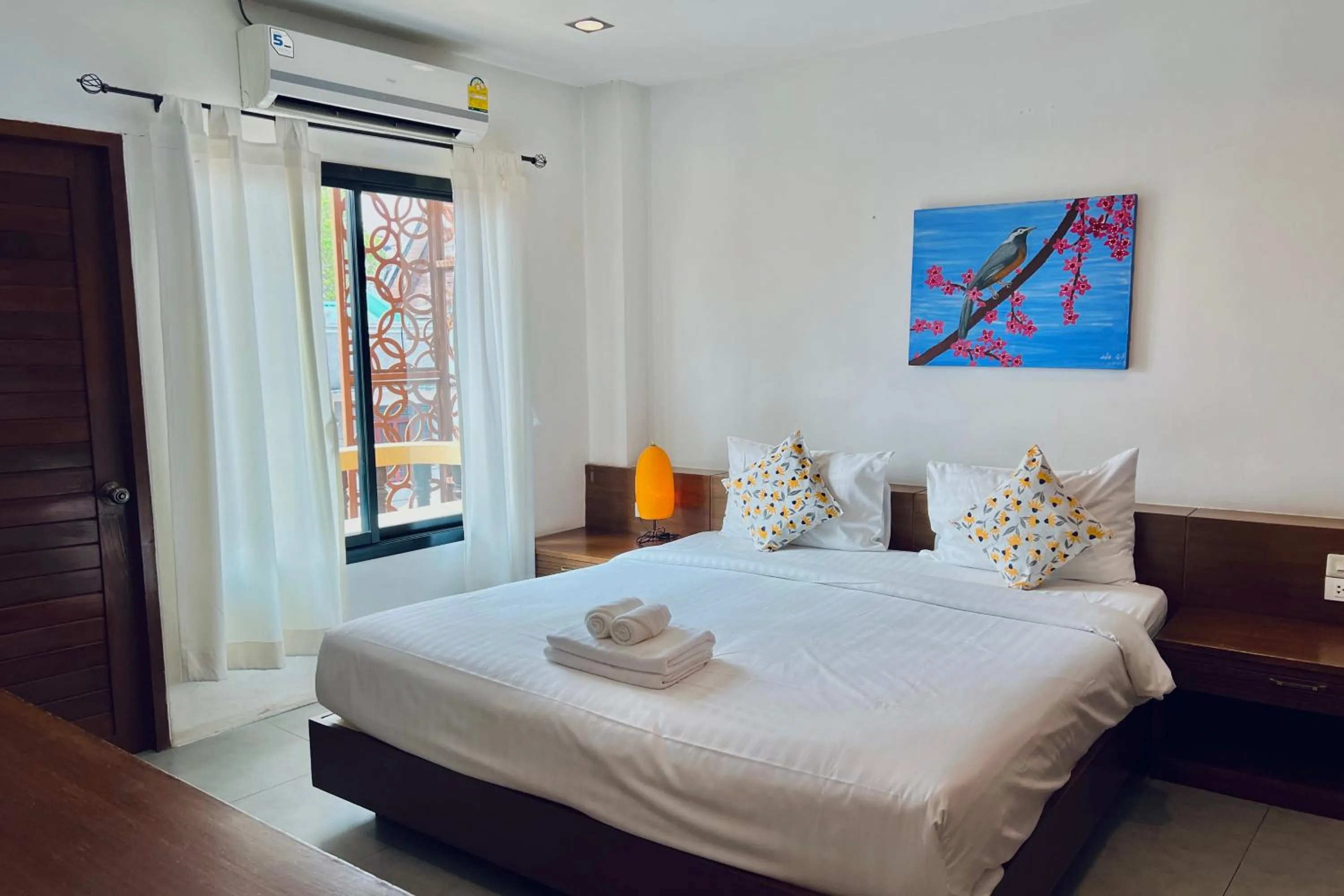 Bed in De Nawarat Chiangmai Boutique Apartment