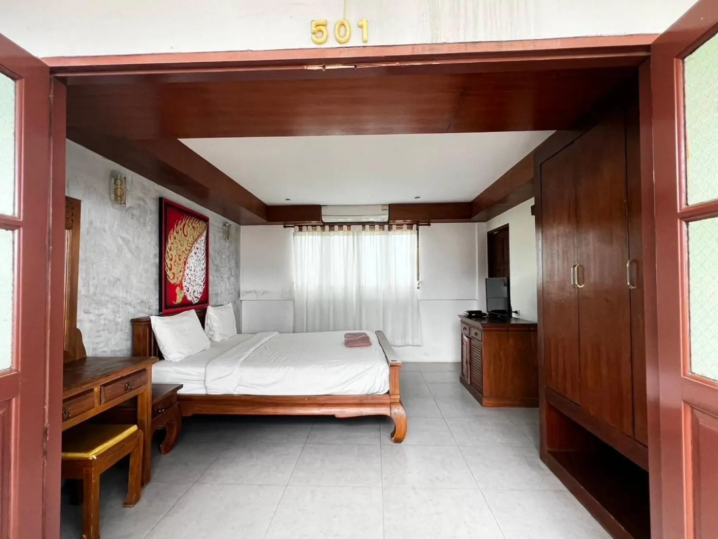 Bed in De Nawarat Chiangmai Boutique Apartment