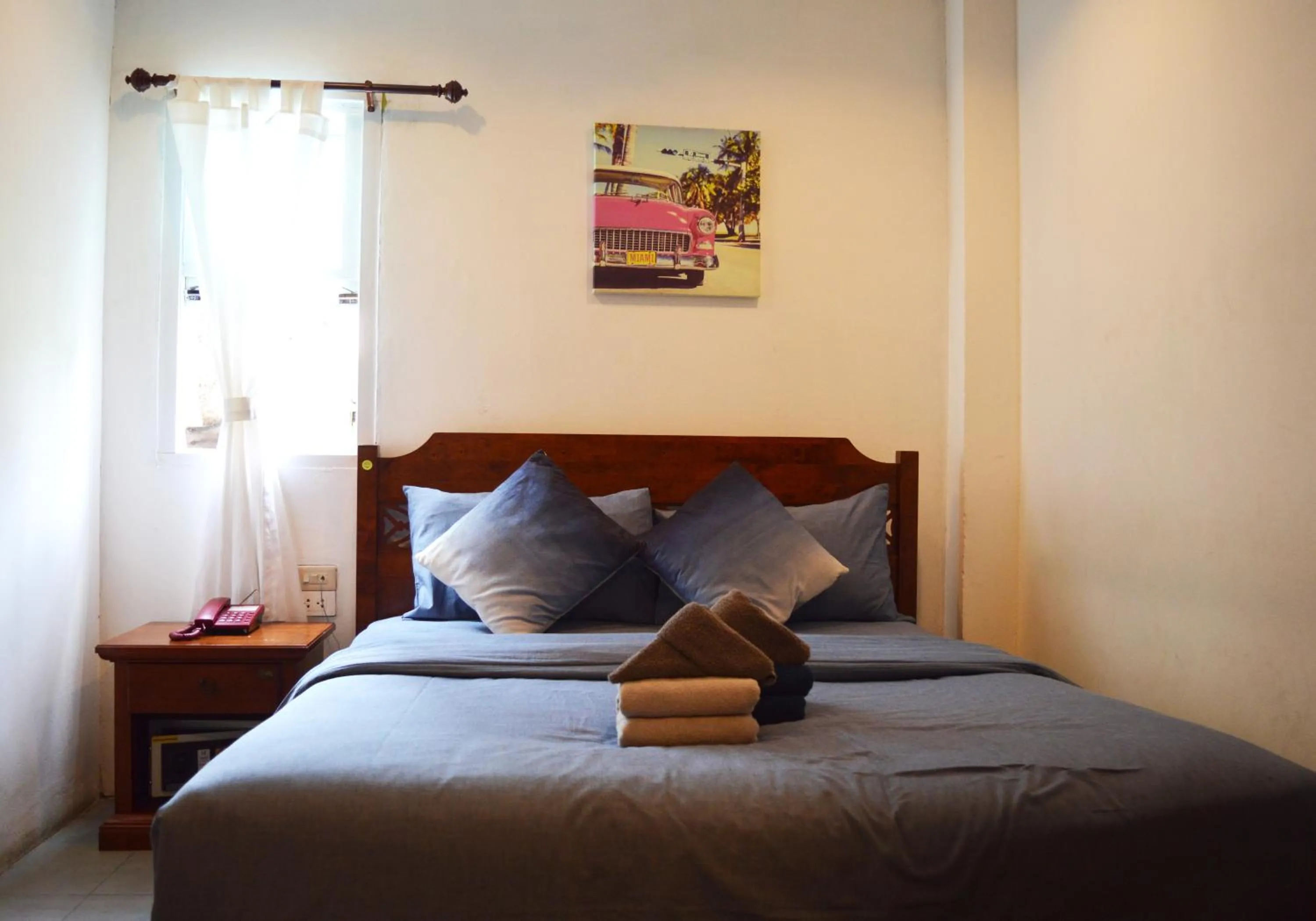 Bed in De Nawarat Chiangmai Boutique Apartment
