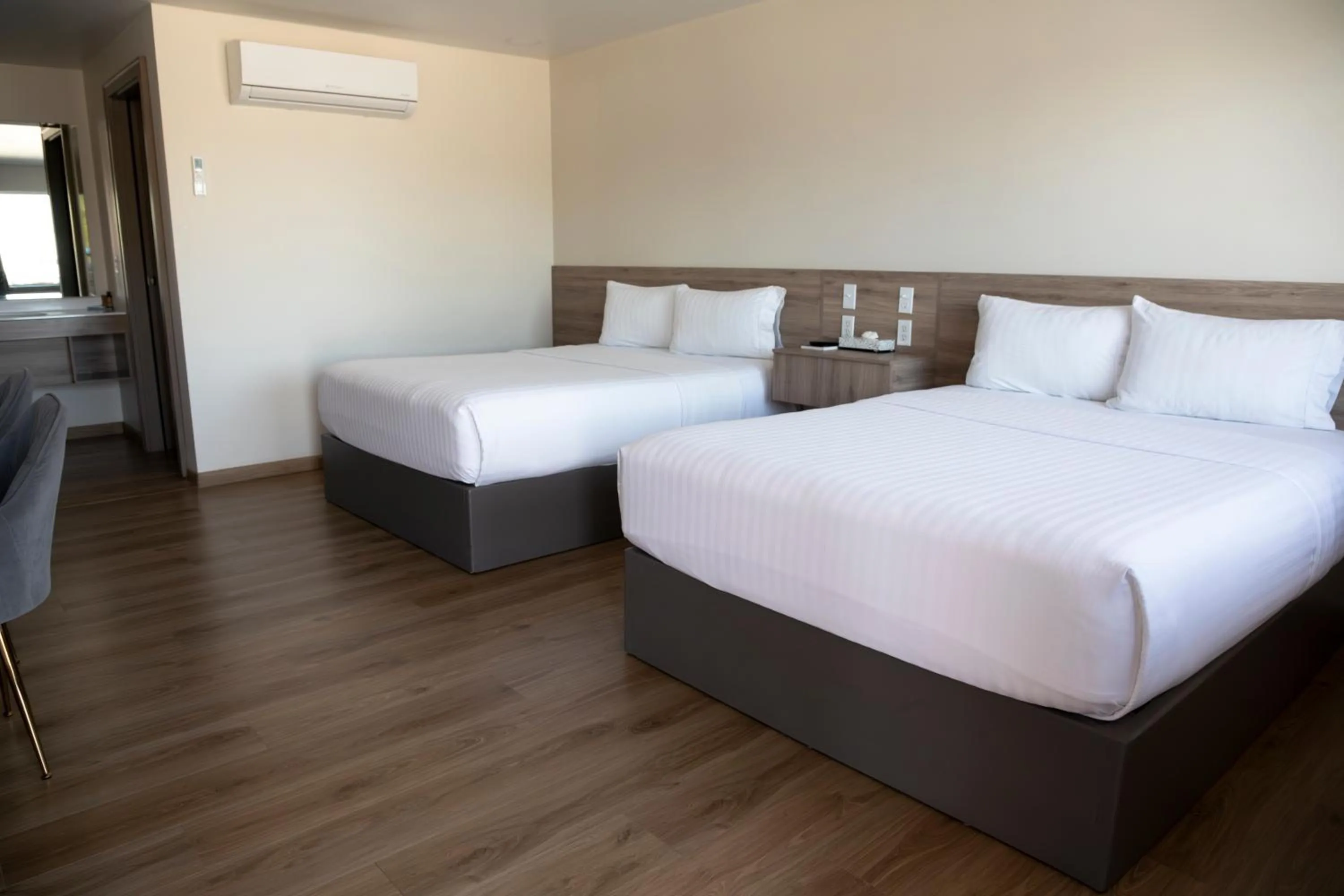 Bed in La Huerta Inn & Suites