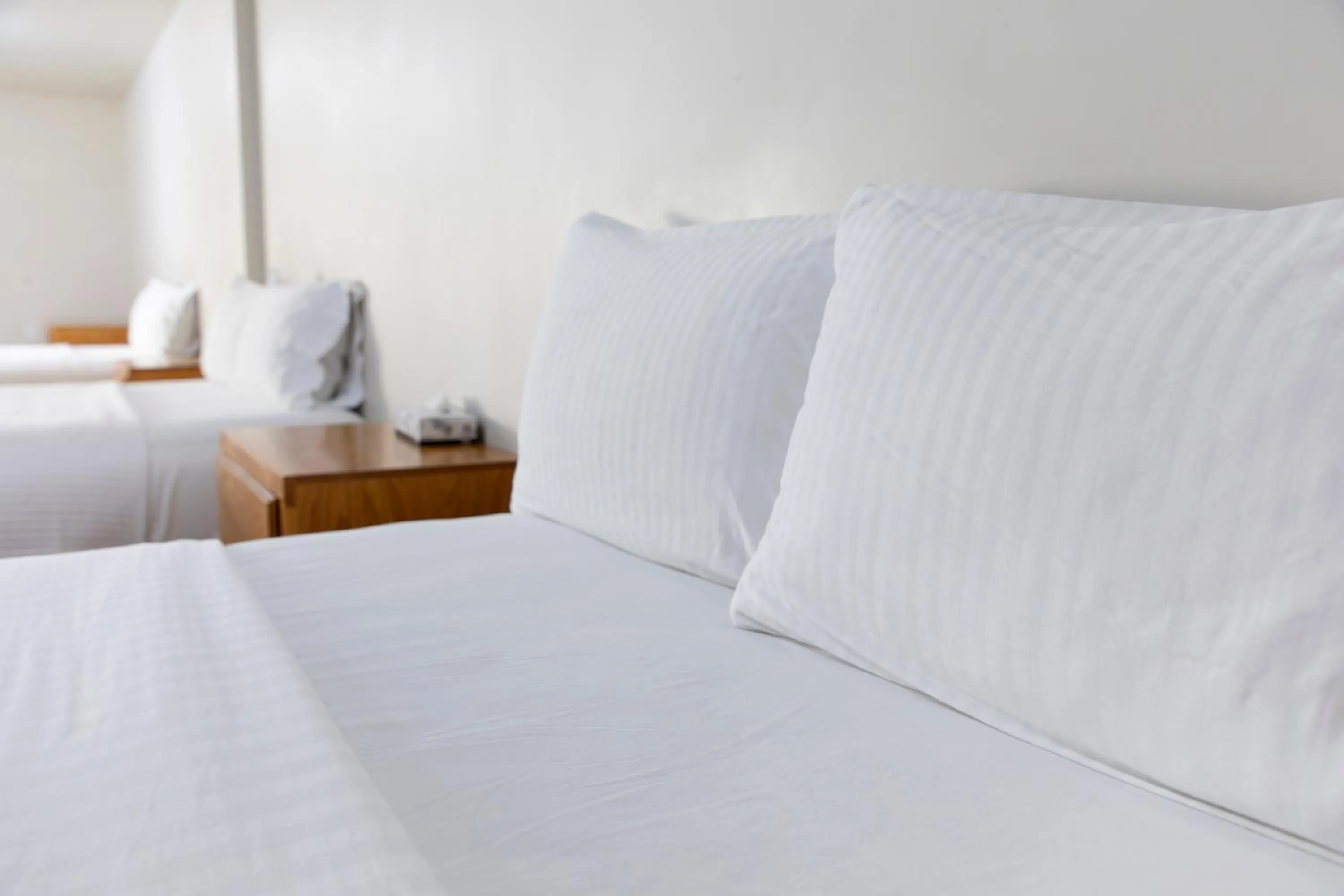 Bed in La Huerta Inn & Suites