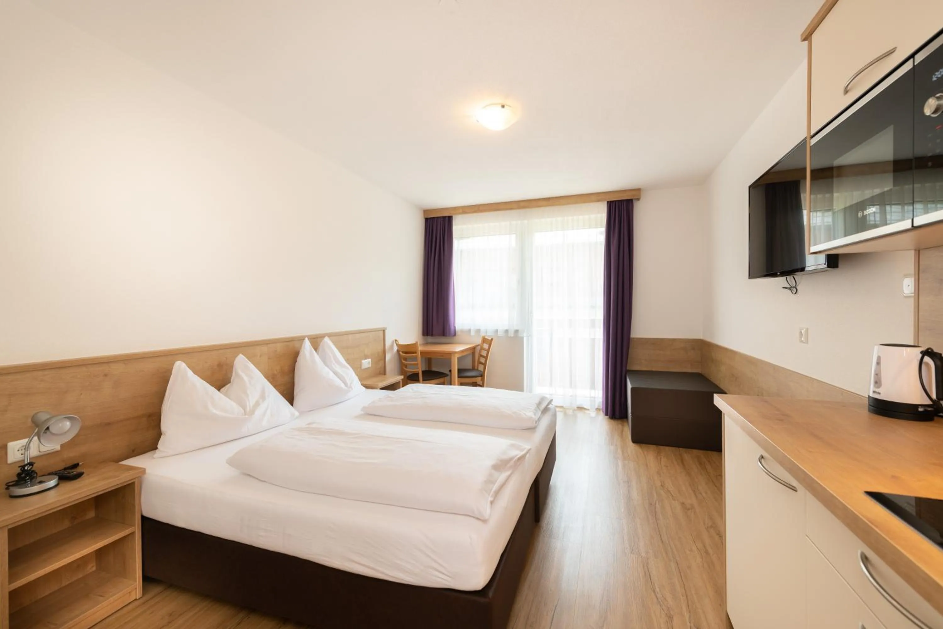 Bed in Hotel-Pension Egger