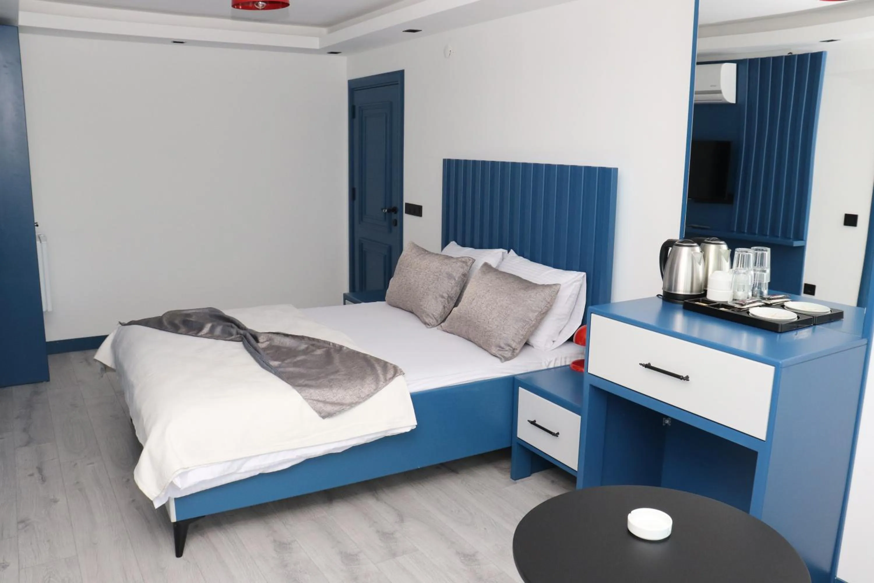 Bed in Blue Ay Boutique Hotel