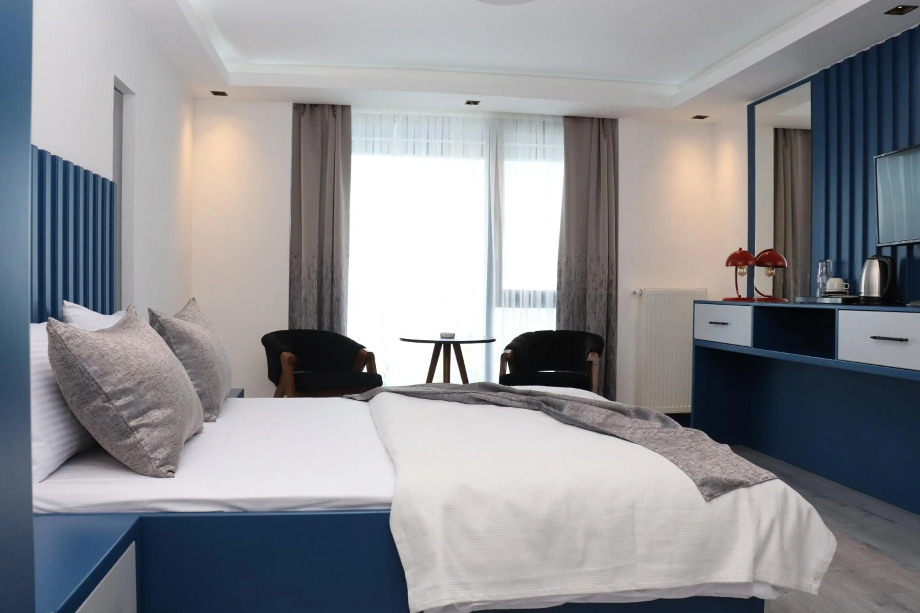 Bed in Blue Ay Boutique Hotel